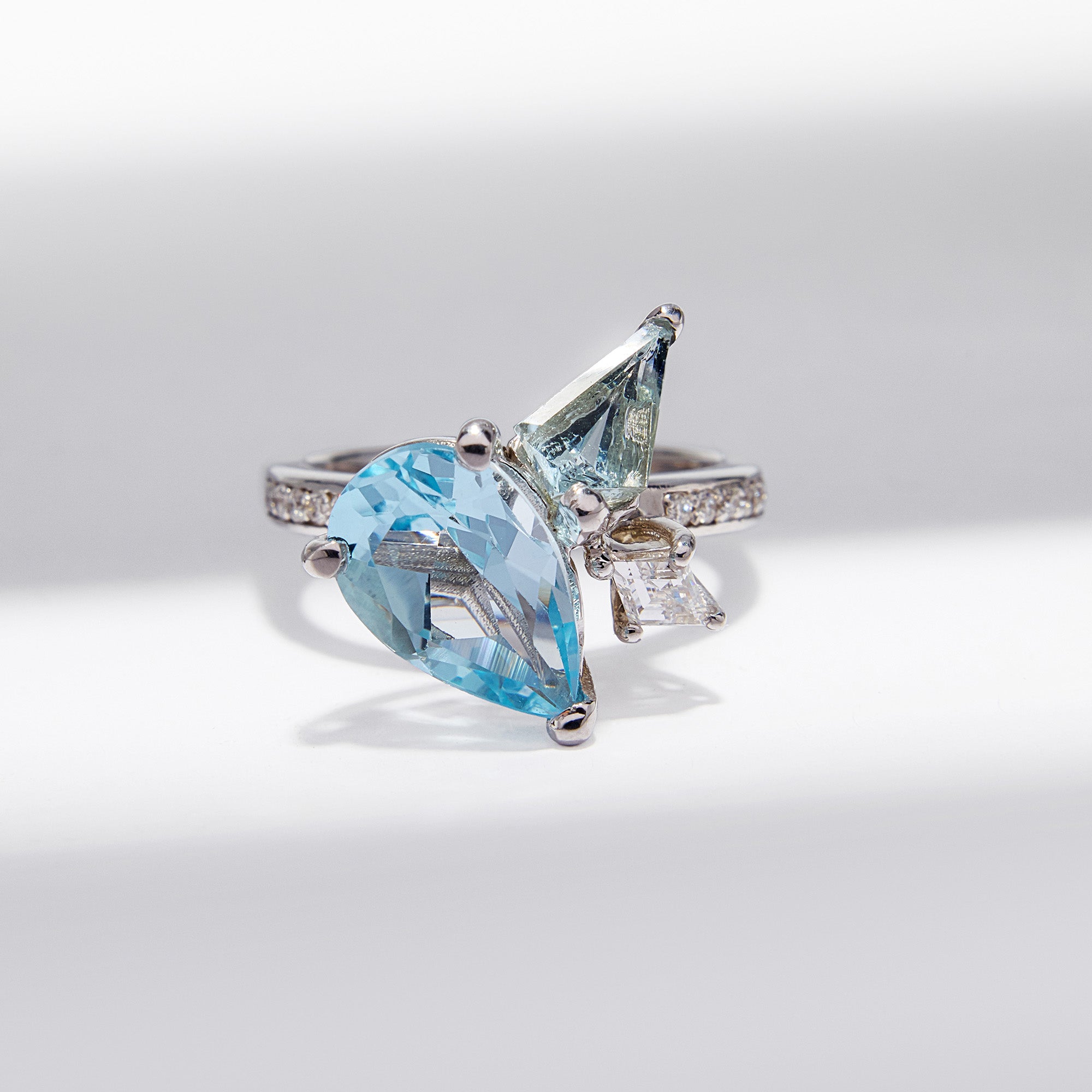 9k white gold Blue Bouquet Ring with topaz, aquamarine & diamonds, inspired by floral elegance, perfect for timeless style.