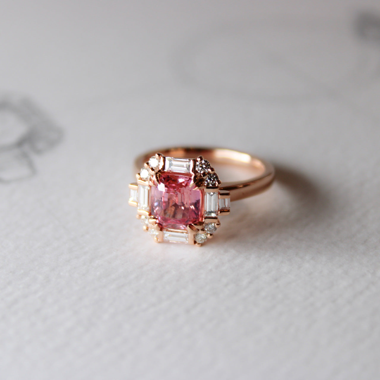 Art Deco inspired Padparadscha sapphire ring with diamonds in 18k rose gold