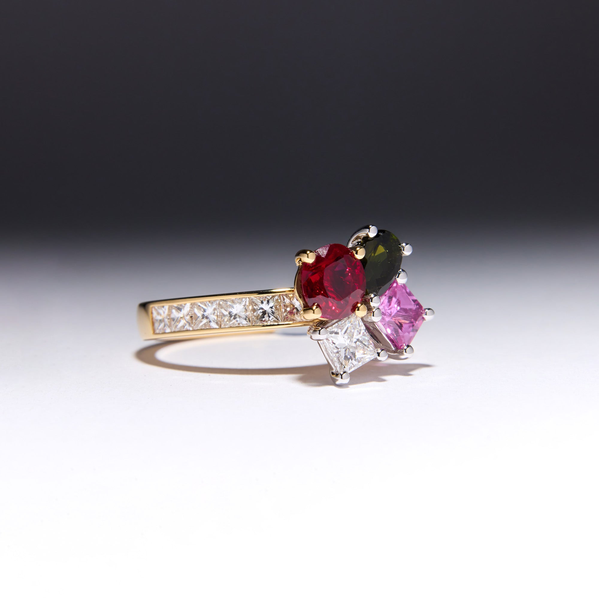 Family Birthstone Bouquet Ring with pink sapphire, green tourmaline, Burmese ruby, and diamonds, remodeled from original ring as a tribute to family.