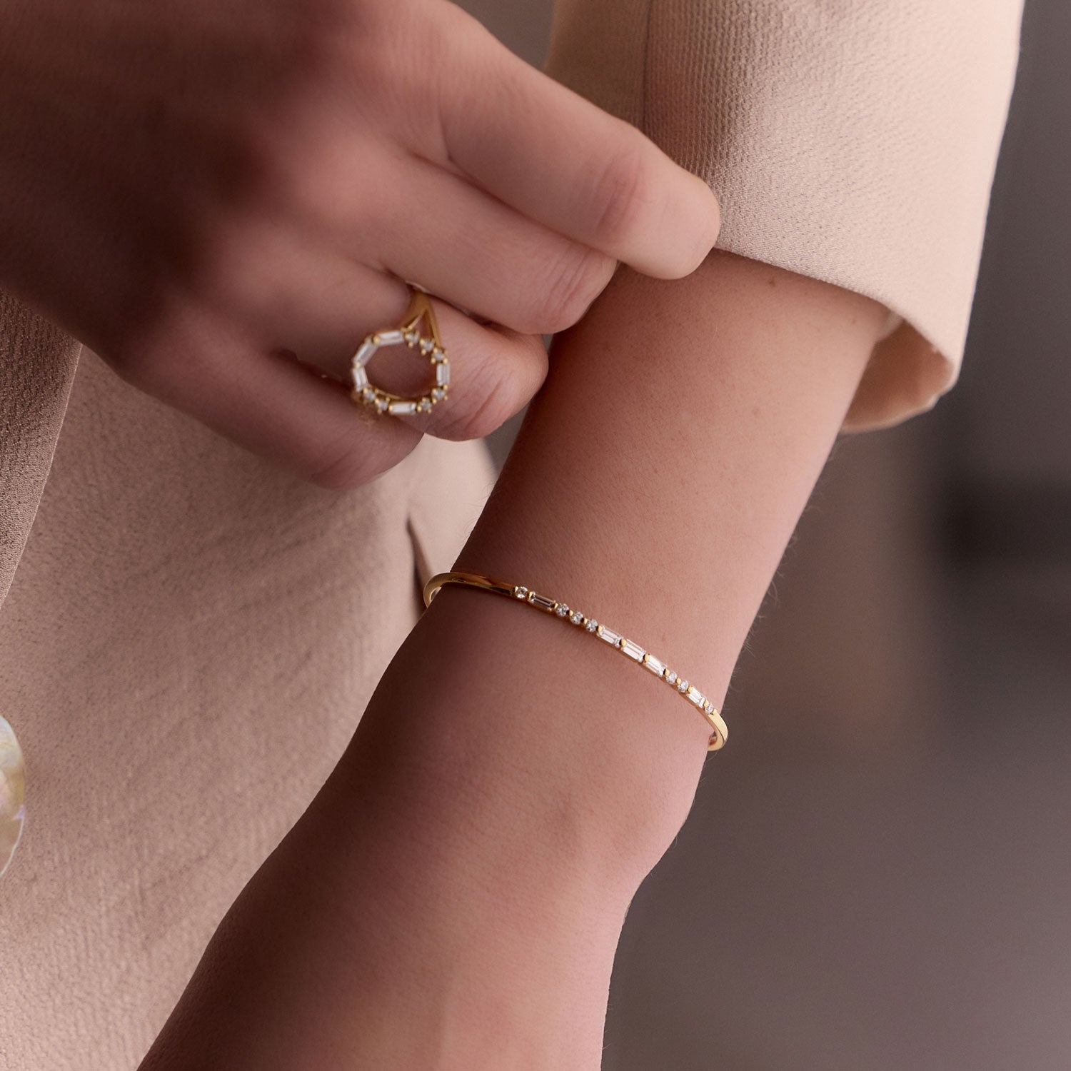 Faith Jewels 18k Yellow gold bangle with round and baguette diamonds spelling “LOVE” in Morse code.