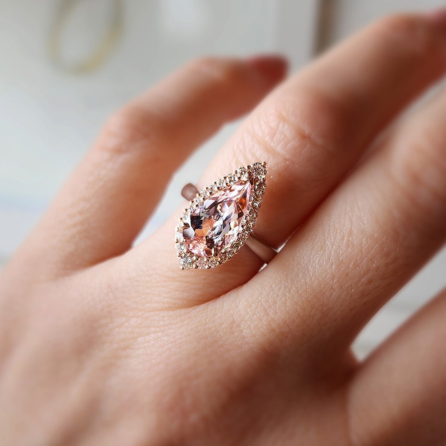 One of a Kind Adeline Morganite Engagement Ring featuring pear-cut pink morganite, round diamond halo, set in 18k rose and white gold.