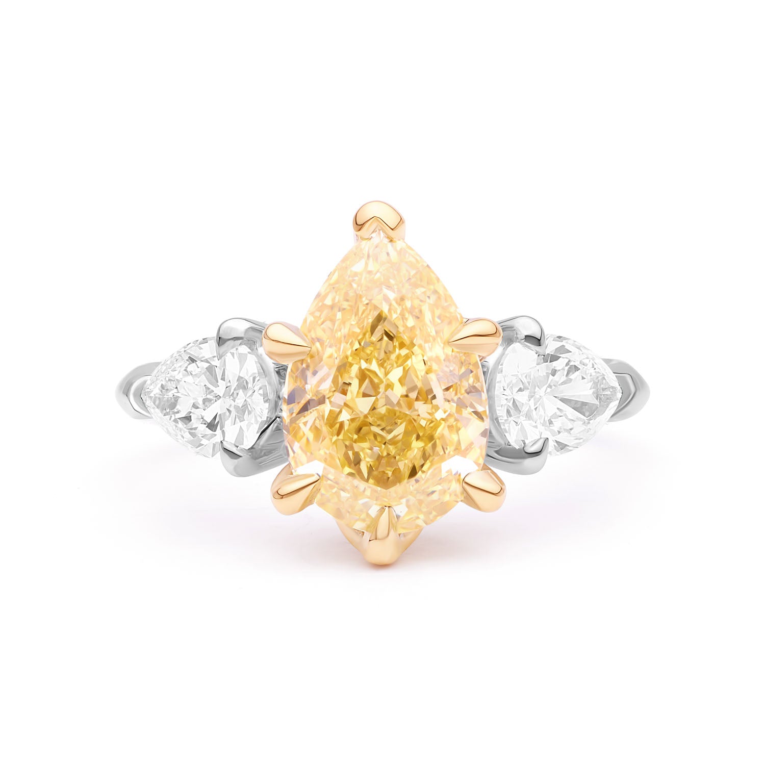 Belle Époque engagement ring with a pear-cut yellow diamond center, flanked by pear-cut white diamonds, set in 18k white gold