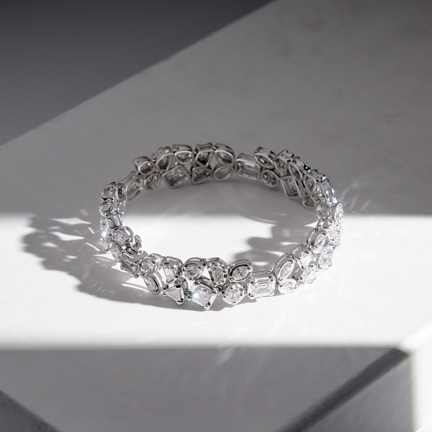 Faith Jewels Bouquet Diamond Bracelet featuring a mix of Marquis, Pear, Hexagon, Shield, Trapezoid, Epaulette, Emerald, and Princess-cut diamonds totaling 10.10 carats