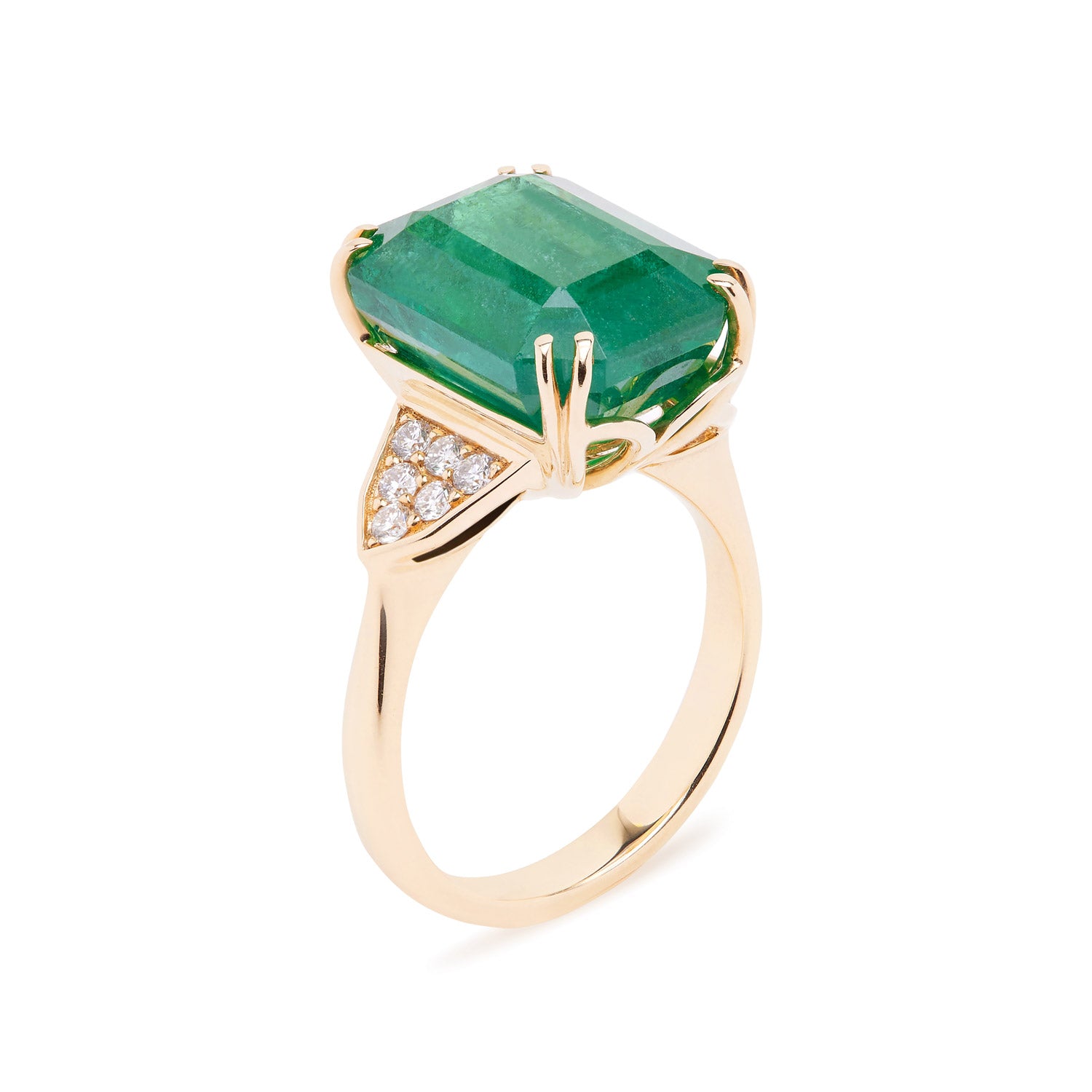 Emerald-cut emerald ring with grain-set diamond accents, set in a yellow gold band.