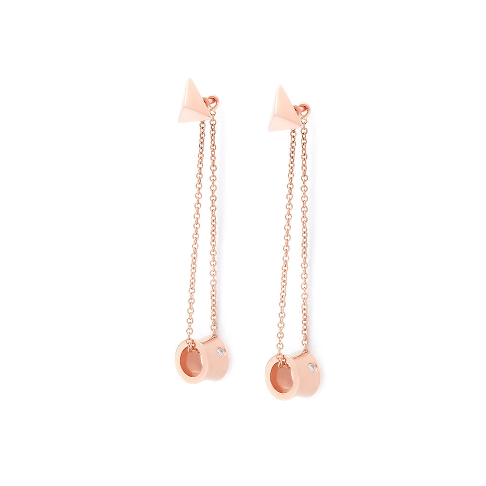 Freedom 18k rose gold drop earrings featuring polished rings with single brilliant-cut white diamonds, suspended from fine trace chains