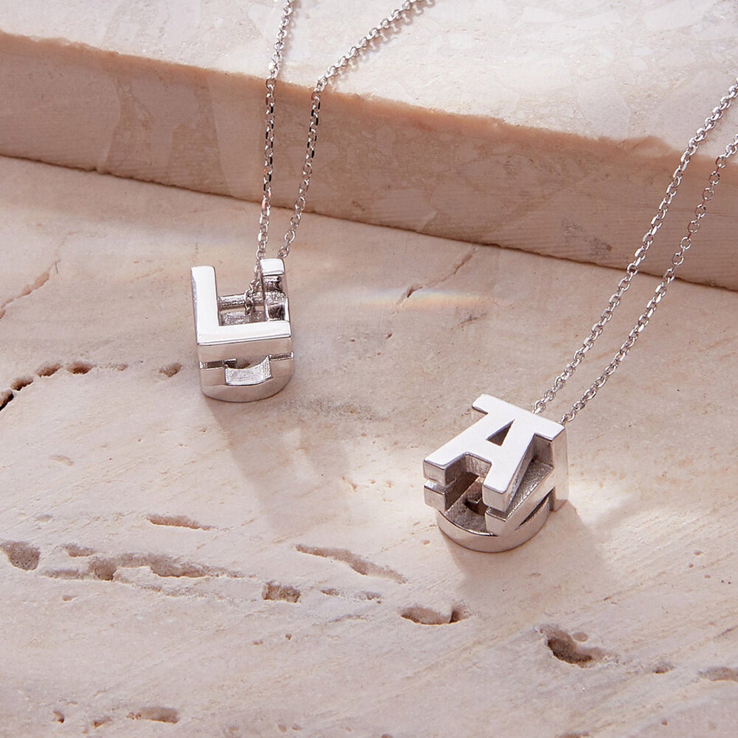 Faith Jewels Bespoke Initial Cube Pendant Necklace featuring a customizable 3D cube design with up to 5 letters, featuring initials L, A and T, suspended from a fine white gold trace chain