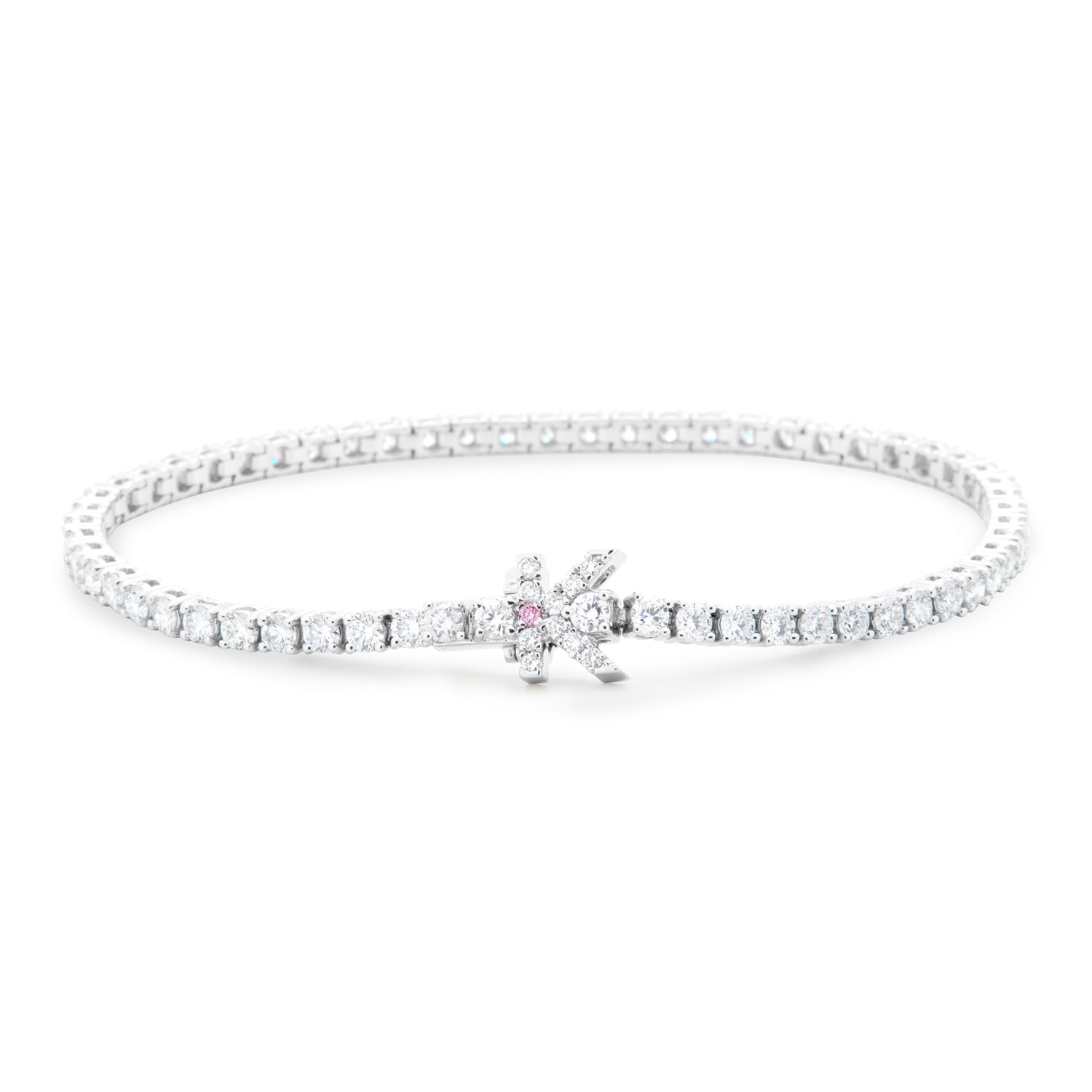 Faith Jewels bespoke initial diamond tennis bracelets in white gold, each featuring a unique clasp shaped as a letter K — set with round brilliant-cut diamonds and argyle pink stone