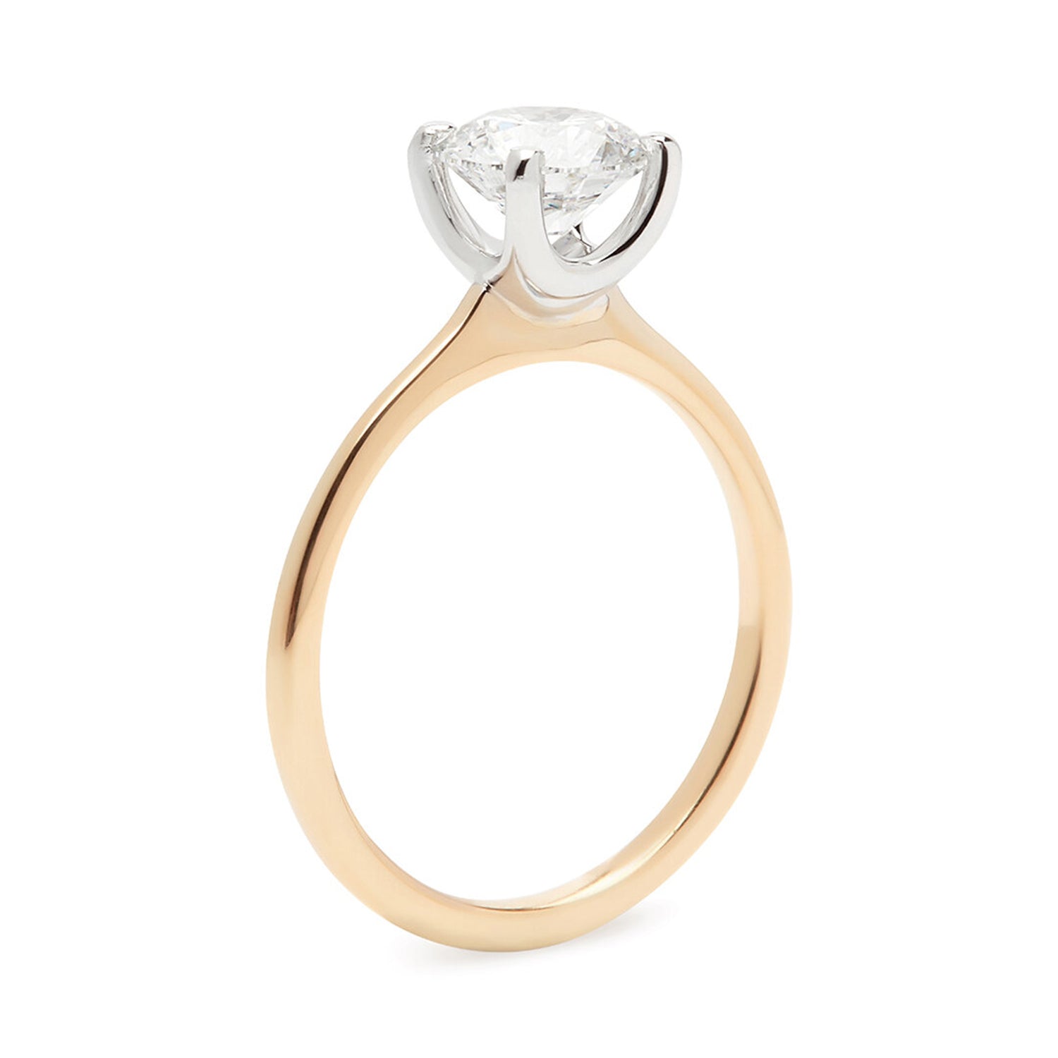 Faith Jewels Jemma diamond engagement ring featuring a classic solitaire design with a tall open four-prong setting and a narrow 18k band to enhance the diamond's brilliance
