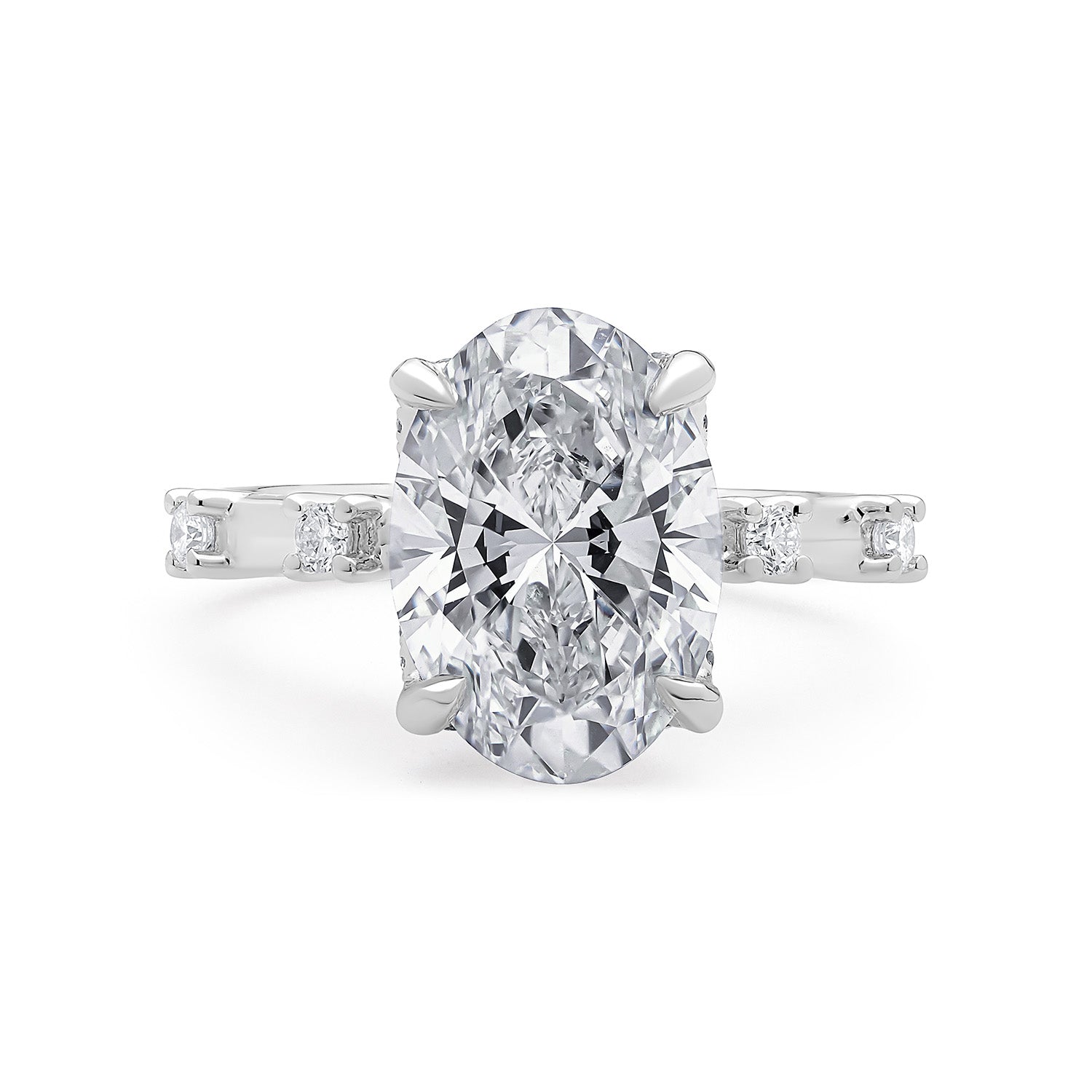 Faith Jewels Katherine diamond engagement ring with a central oval-cut white diamond, accented by four diamonds on an 18k white gold band.