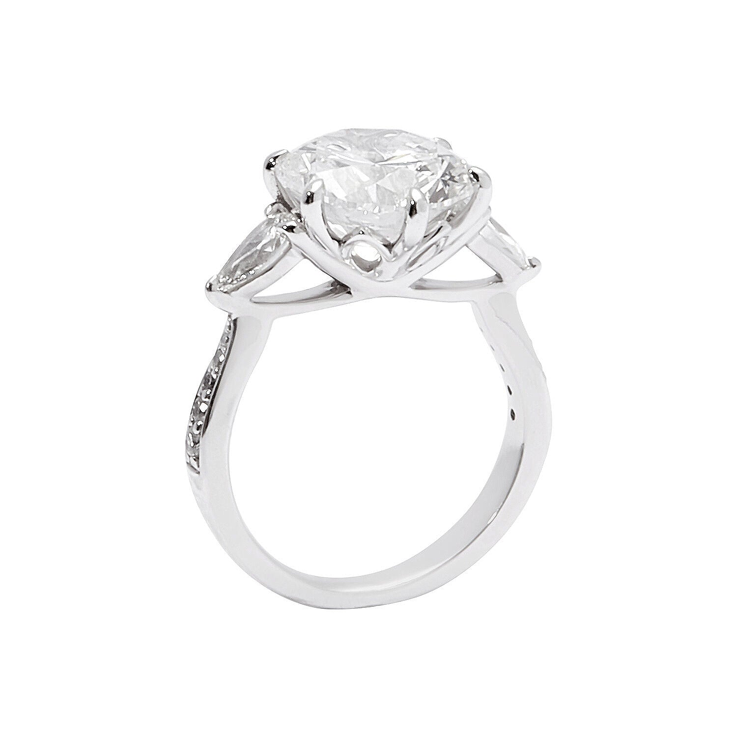 Faith Jewels Lotus engagement ring featuring a round brilliant-cut diamond flanked by two pear-cut diamonds on a tapered pavé diamond band, inspired by the lotus flower