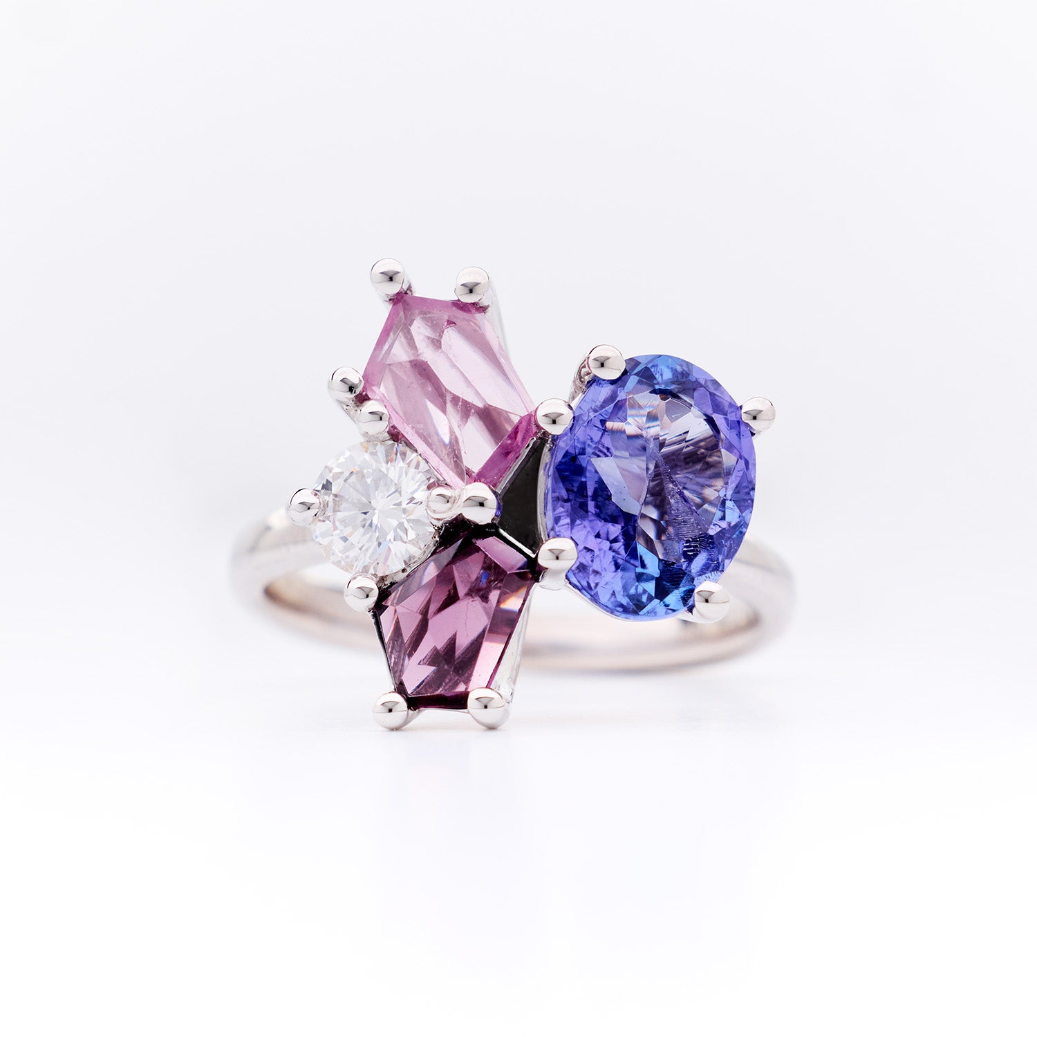 White gold ring from the Faith Jewels Bouquet Series featuring tanzanite, blush spinel, purple spinel, and an heirloom diamond