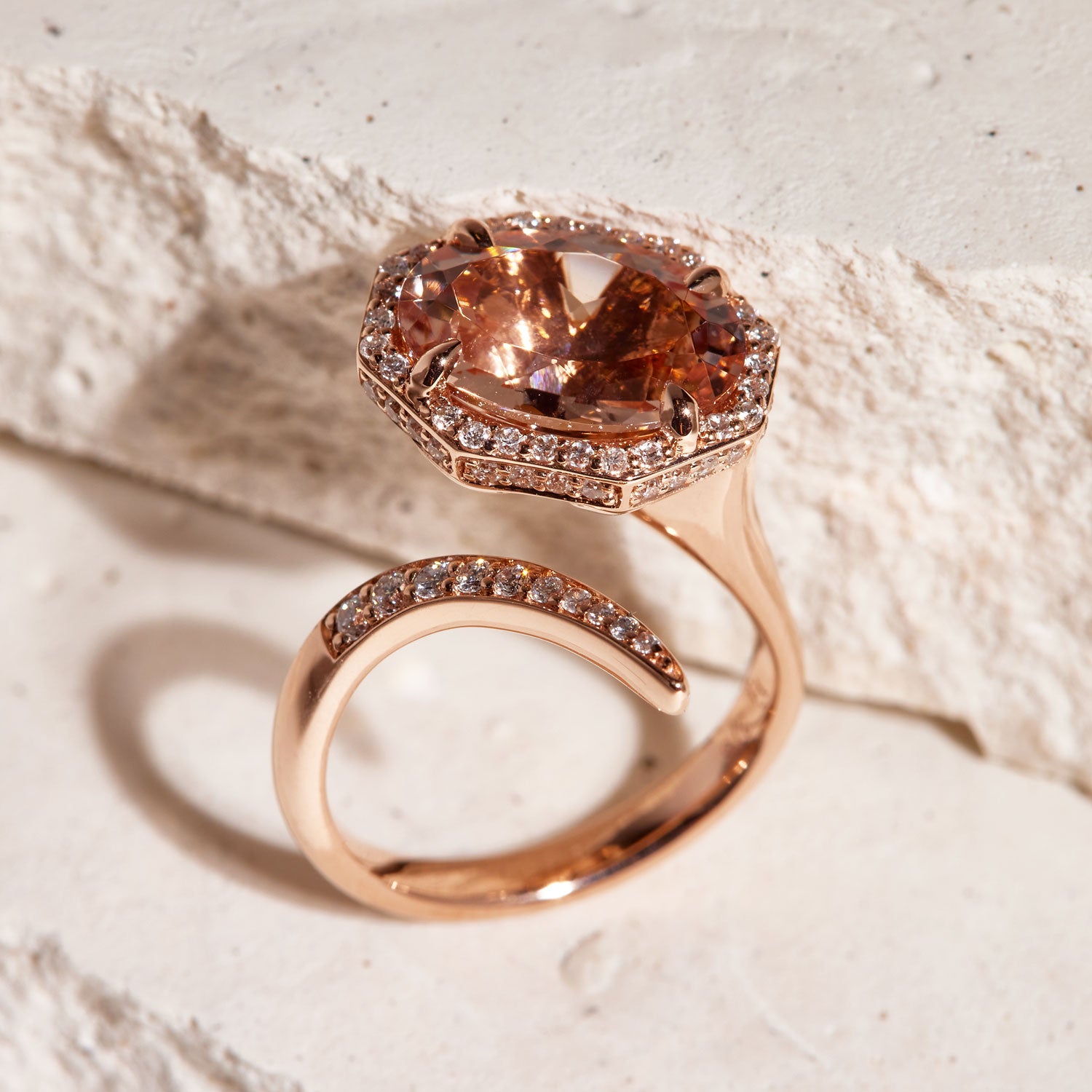 Faith Jewels Serpenti ring in 18k rose gold featuring a pink morganite center surrounded by a halo of white diamonds