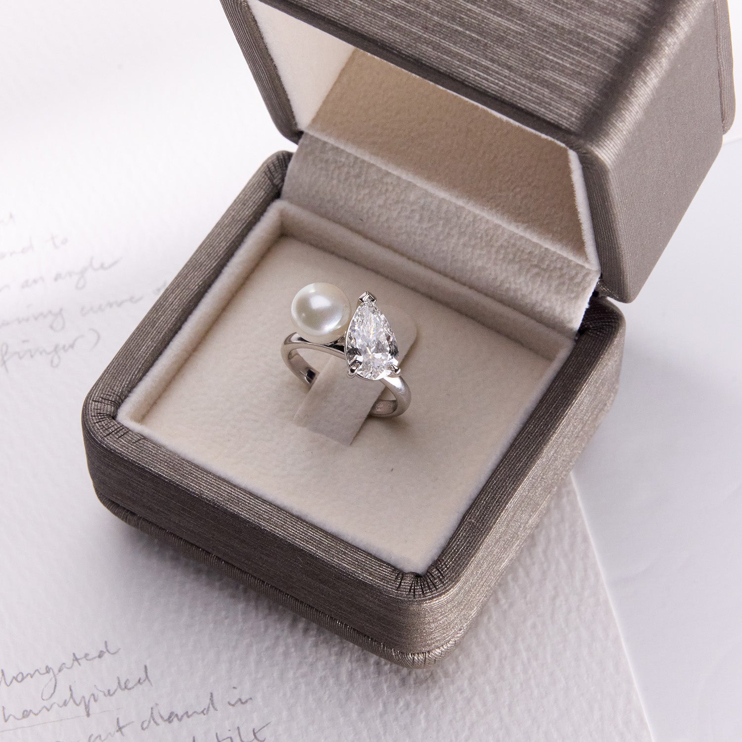 Unique Faith Jewels Toi Et Moi ring with a pear-cut diamond and hand-shucked pearl