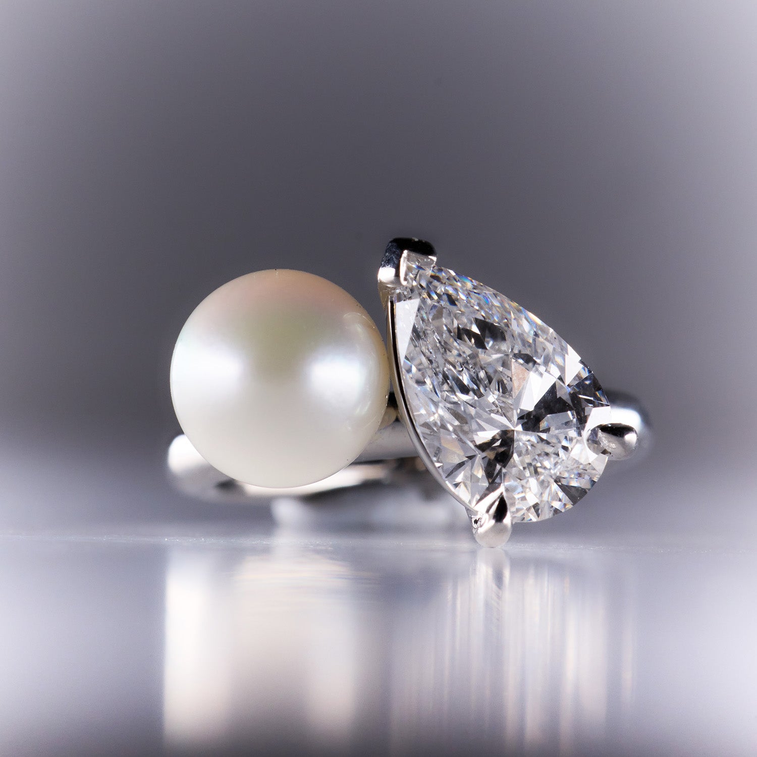 Unique Faith Jewels Toi Et Moi ring with a pear-cut diamond and hand-shucked pearl