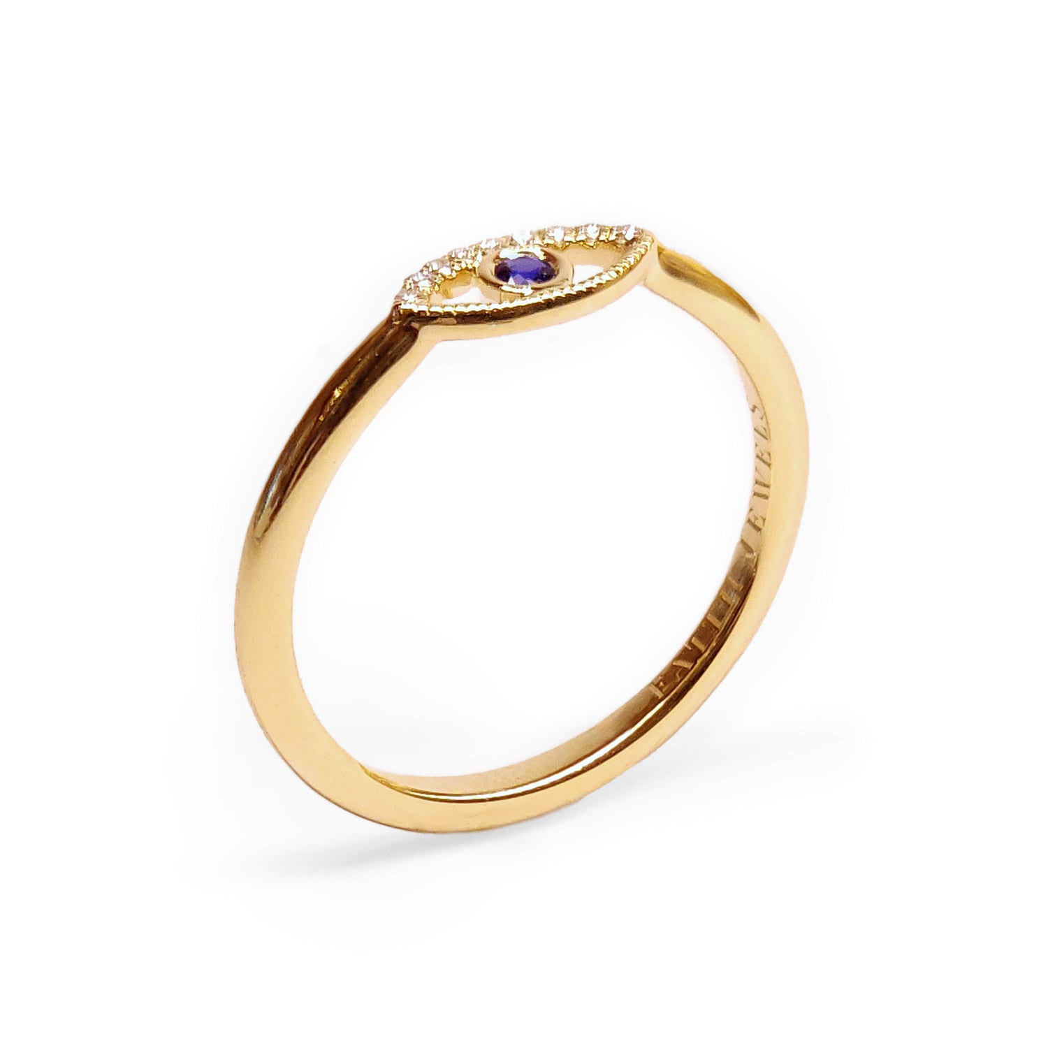 Faith Jewels Protection Ring featuring a yellow gold band with an evil eye design, accented by white diamonds and a central blue sapphire.