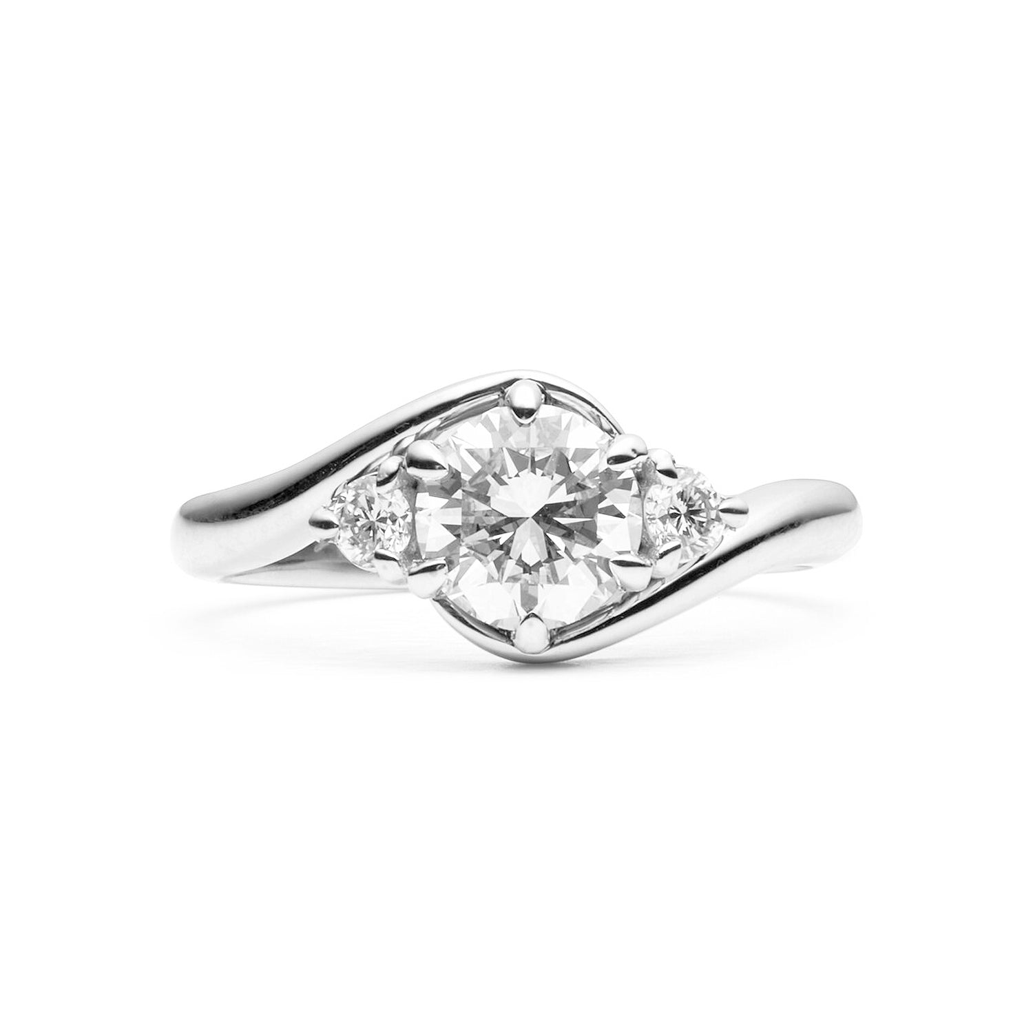 Faith Jewels Rue diamond engagement ring with a round brilliant-cut center diamond, flanked by two smaller brilliant-cut diamonds, featuring a twist band design