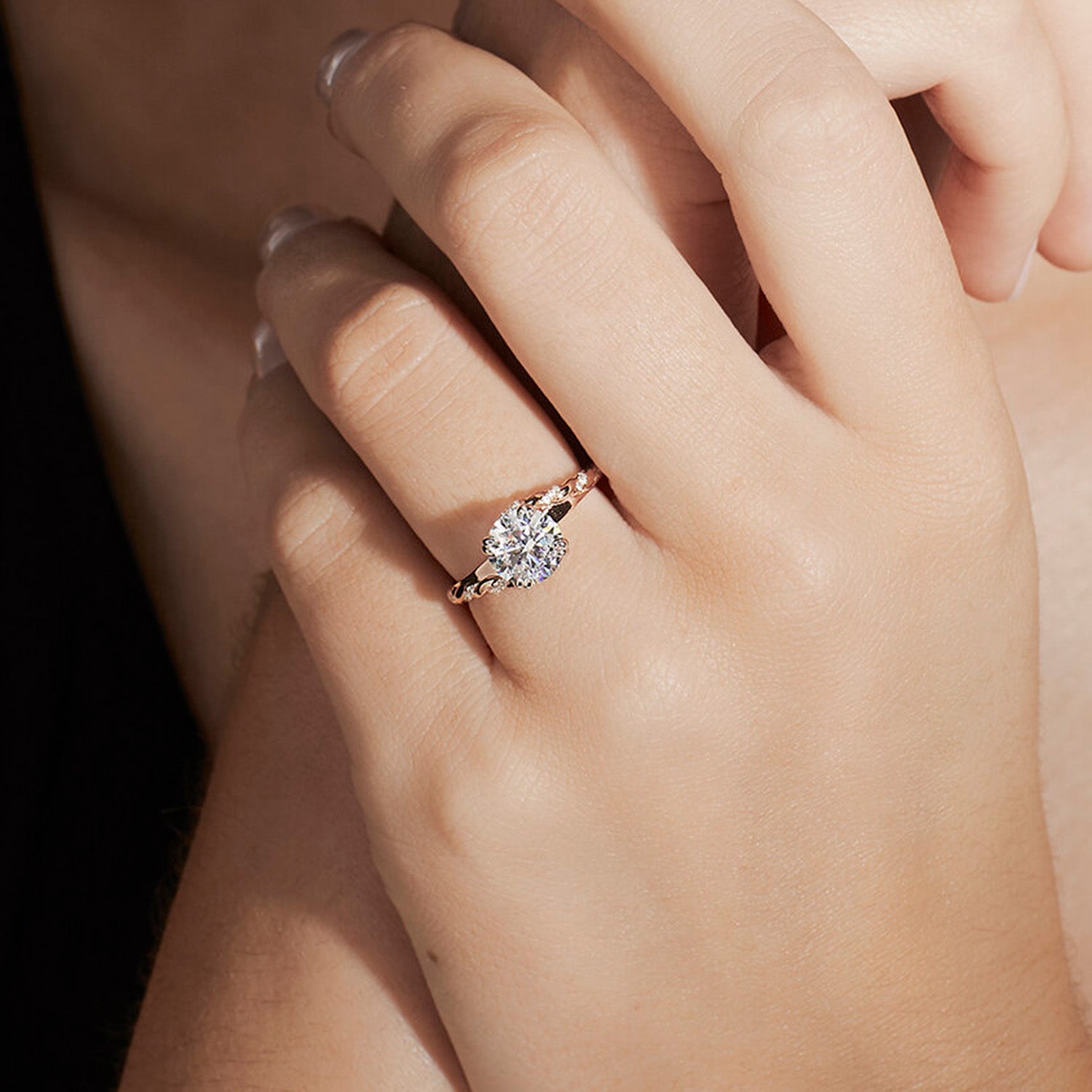 Faith Jewels True Lovers Knot engagement ring with a knotted rope-like sculpted setting entwining the feature diamond in rose gold band