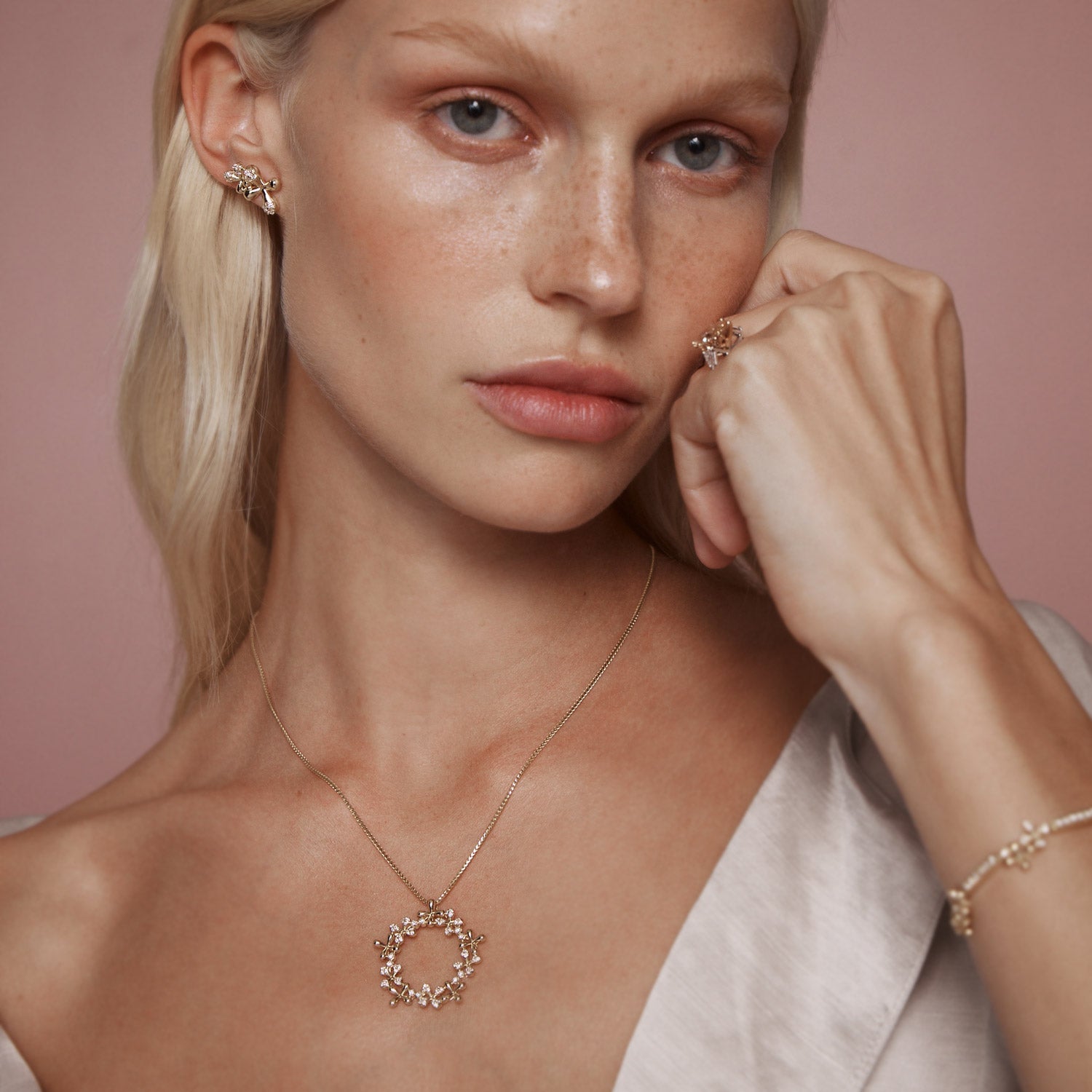 Maxi Diamond Stud Earrings in 18k yellow gold with 24 diamonds totaling 1.00ct and floral motifs, worn on model with Wildflower collection