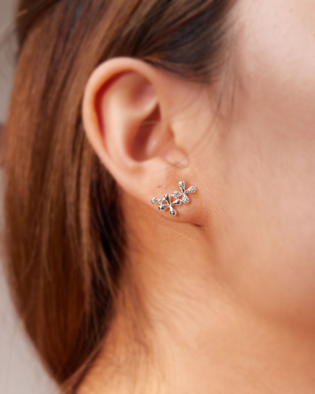 Medium Diamond Stud Earrings in 18k white gold with floral motifs set with 0.15ct natural diamonds