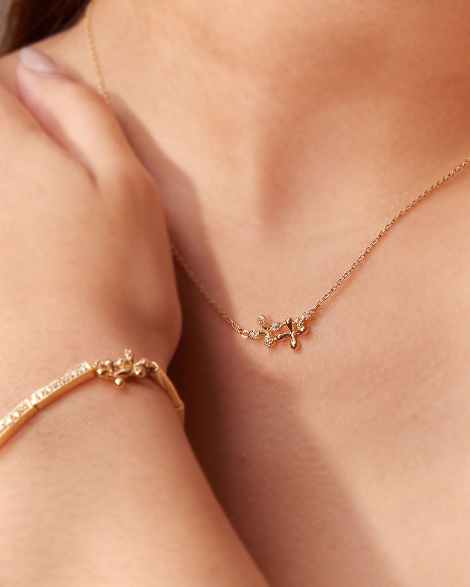 Diamond Necklace in 18k yellow gold with floral motifs and 0.15ct natural diamonds, 45cm chain, worn on model.