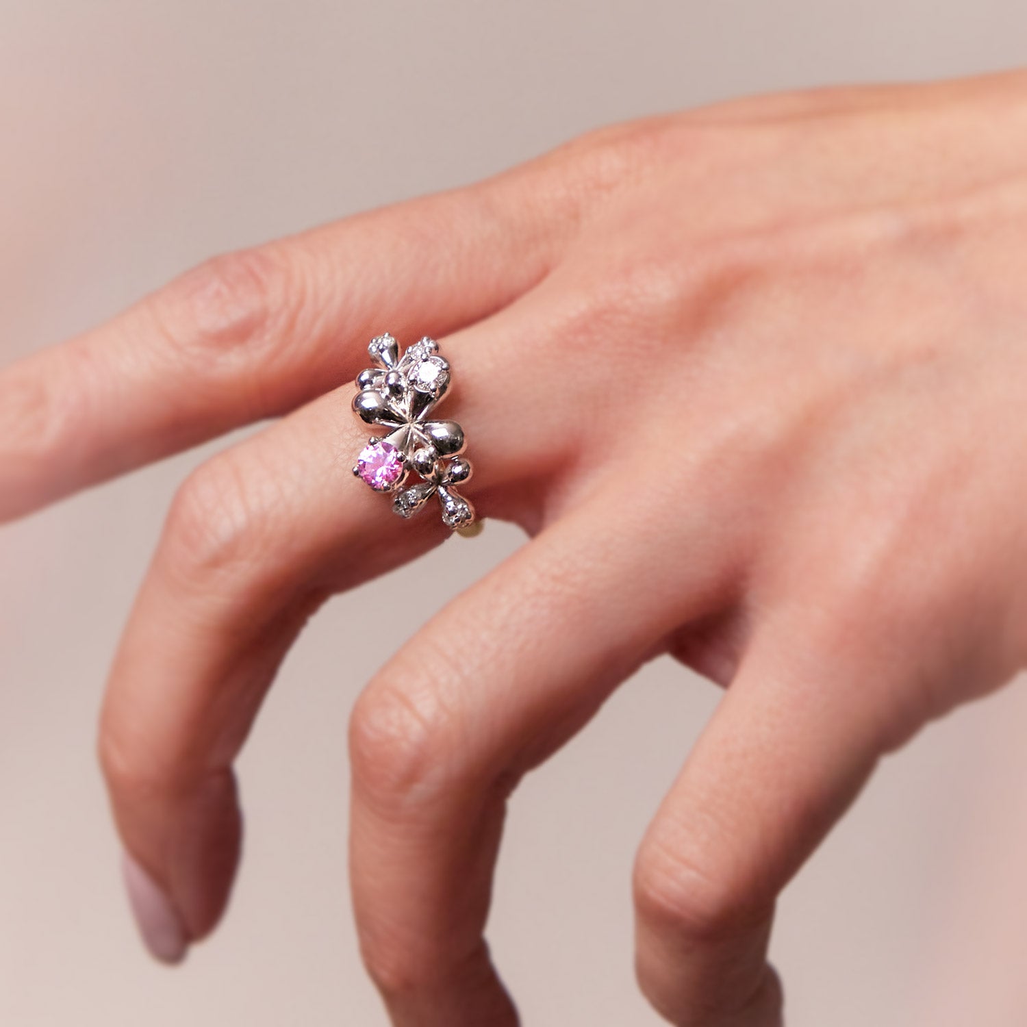 Pink Sapphire and Diamond Ring in 9k white and yellow gold with 0.40ct pink sapphire and 0.35ct diamonds, worn on model.