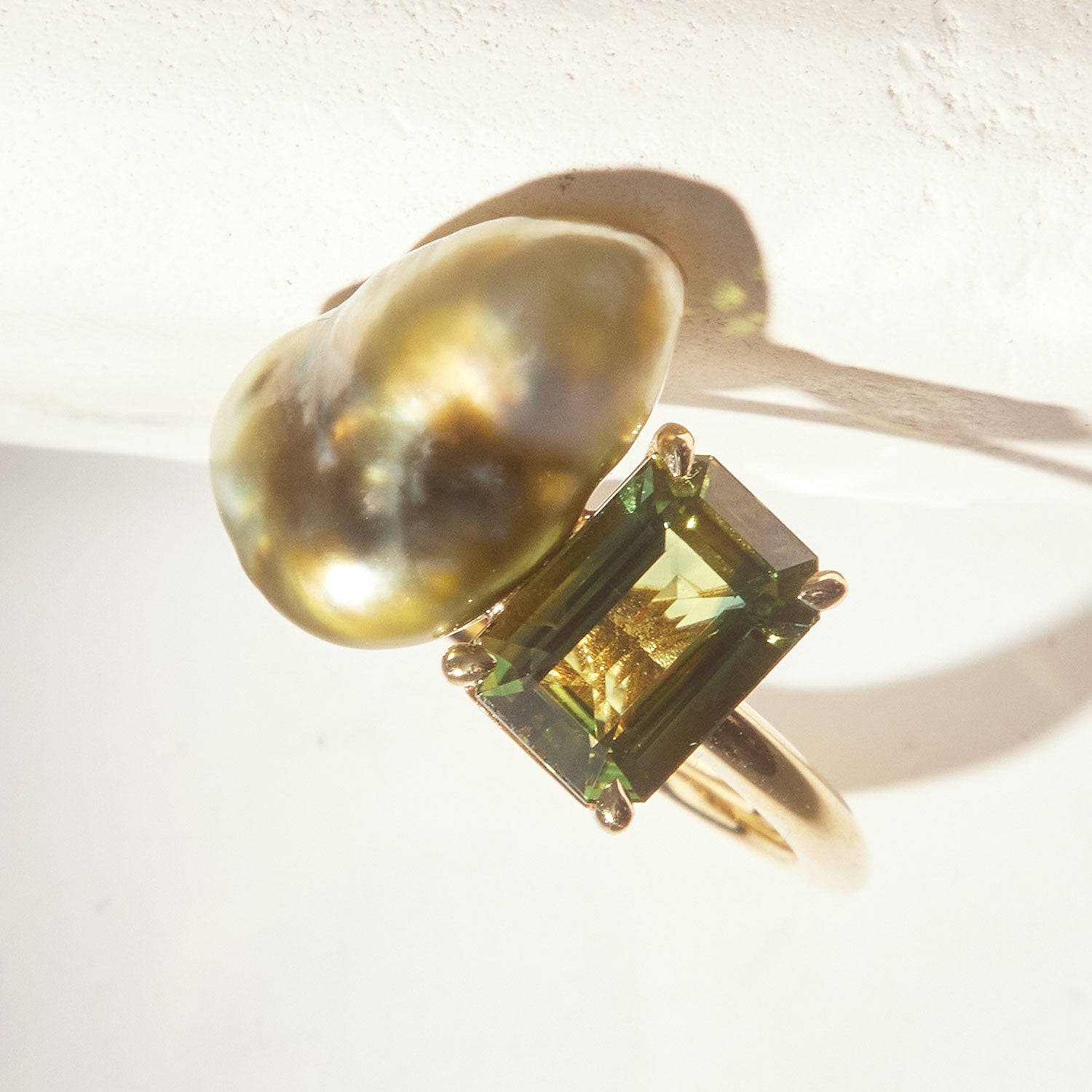 Faith Jewels Toi et Moi ring featuring a baroque pearl and tourmaline set in an 18k yellow gold band
