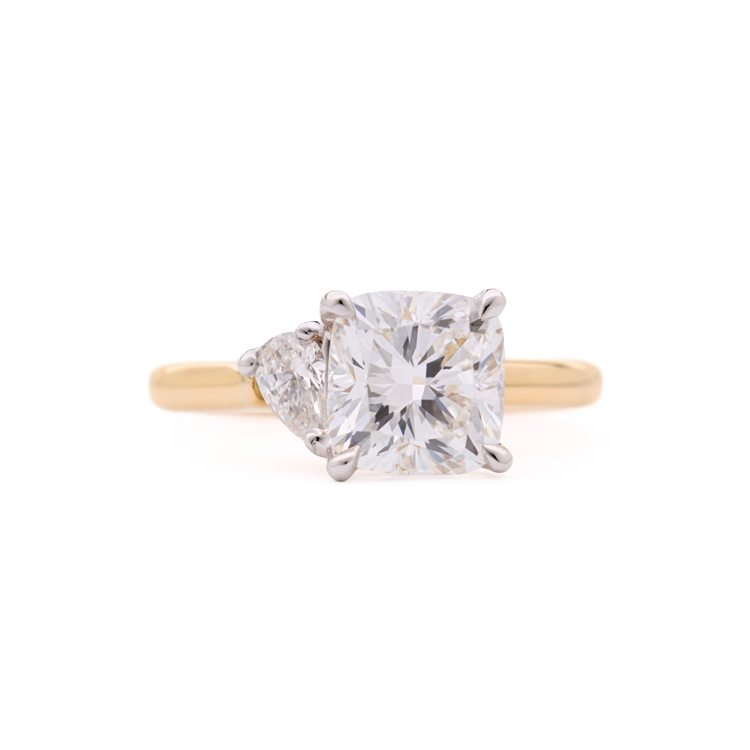 Faith Jewels bespoke ring featuring a pear-cut diamond paired with a cushion-cut diamond in a Toi Et Moi design.