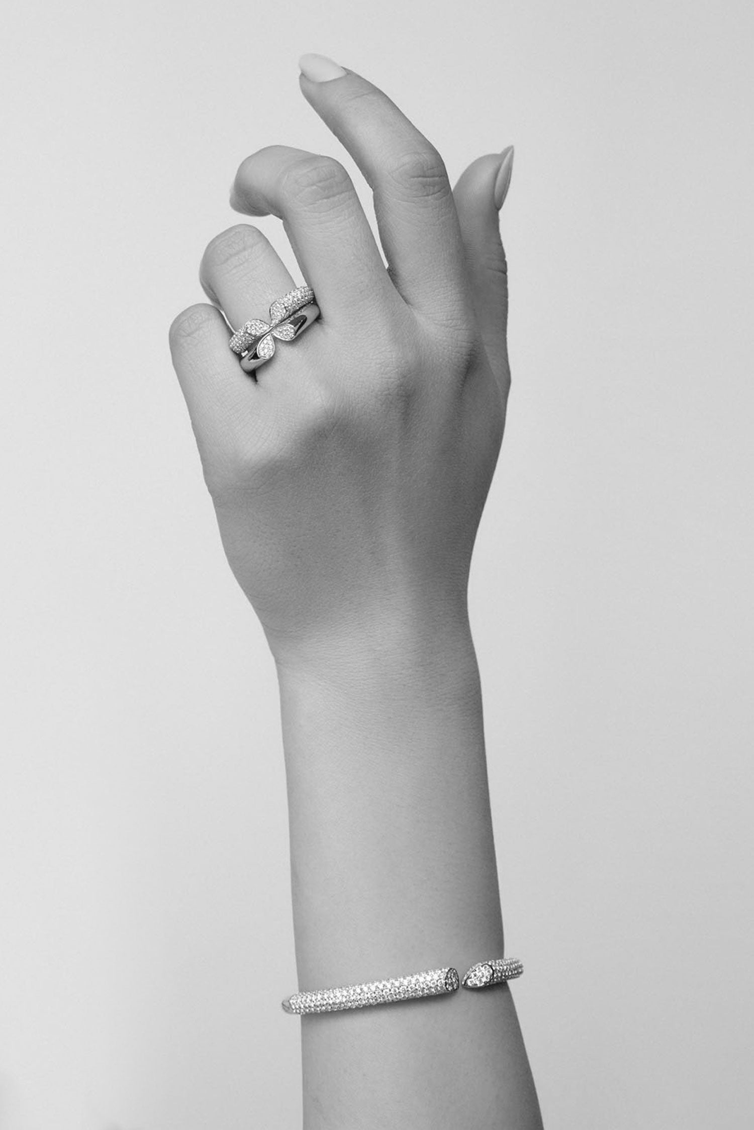 Model wearing rings and bracelet from Whispers of Love collection.