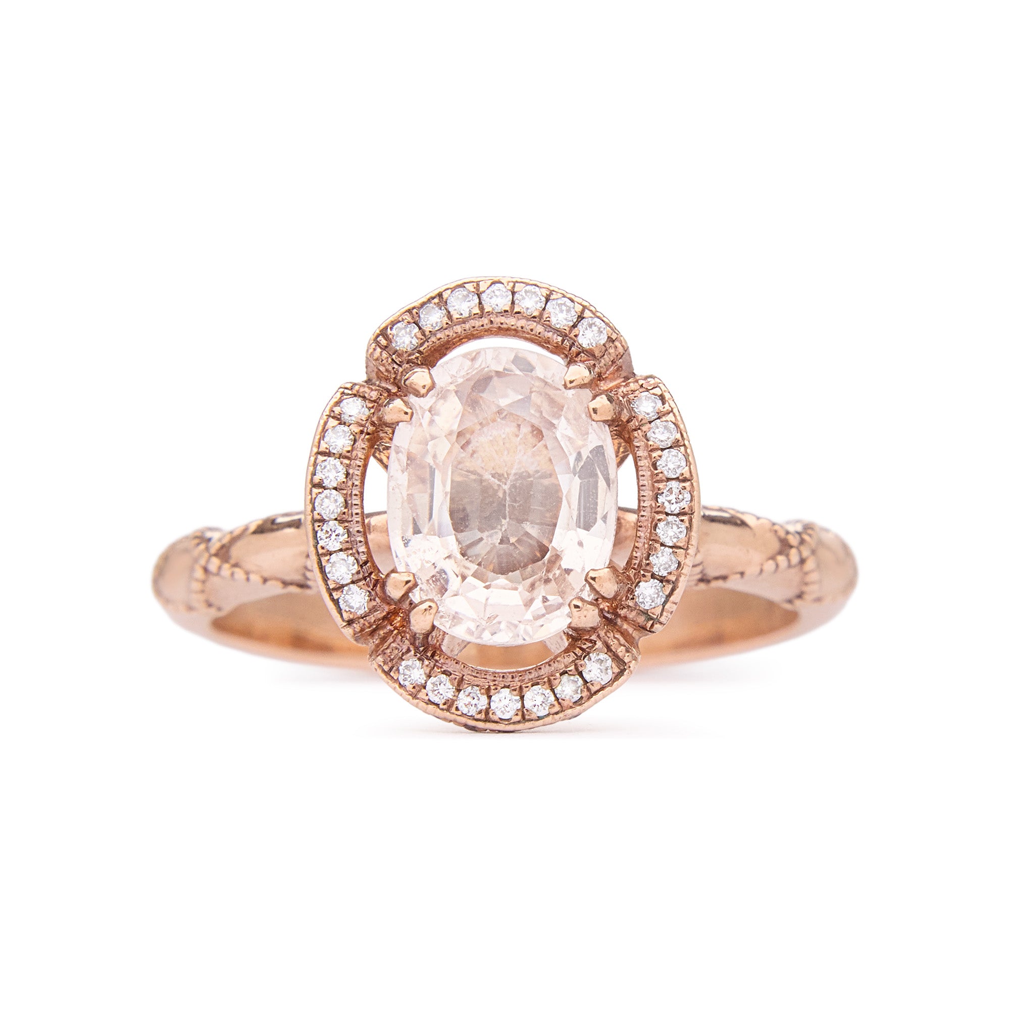 One of a kind ring with 1.20ct oval sapphire, micro-set diamonds, and rose gold rose-petal-inspired design