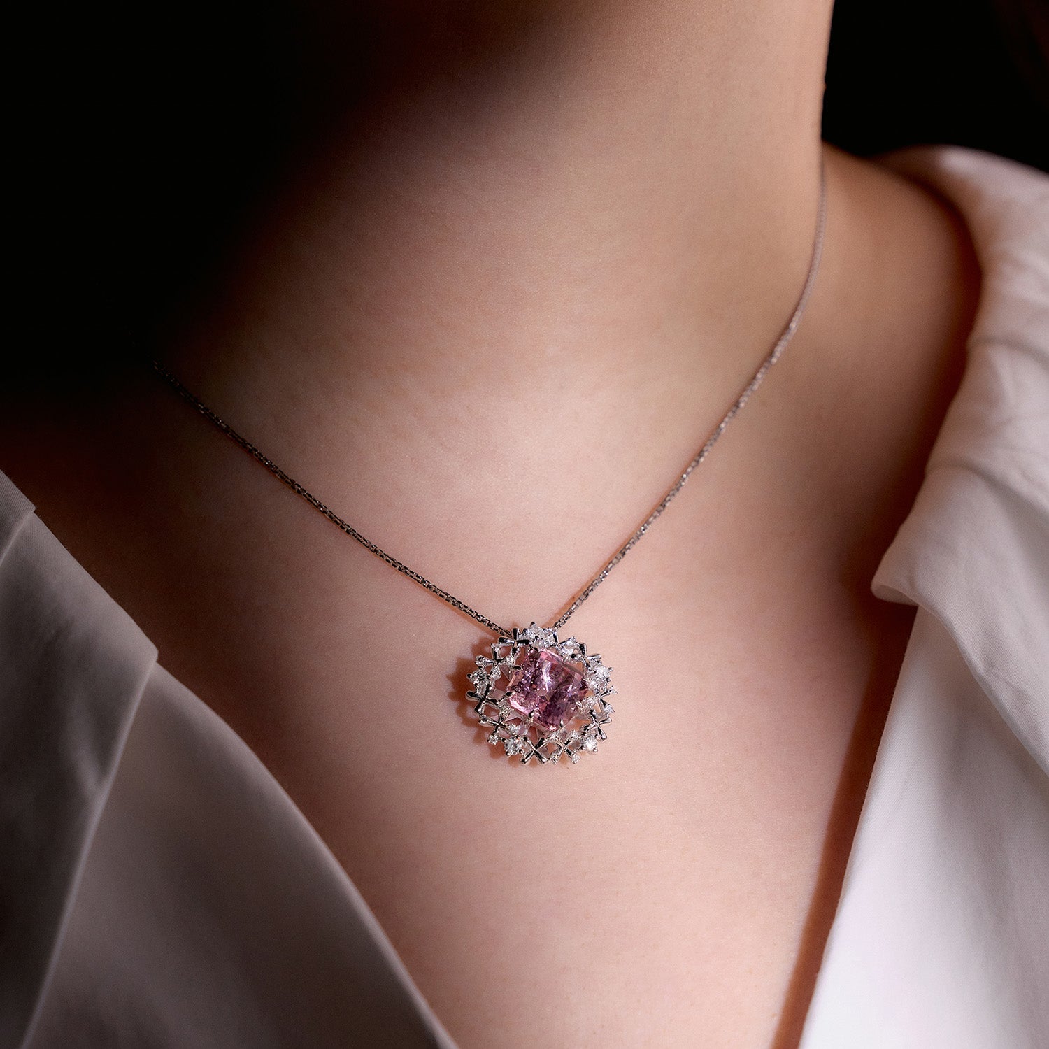 Faith Jewels Pink tourmaline pendant and earrings set in 18k white gold with diamond floral accents on model