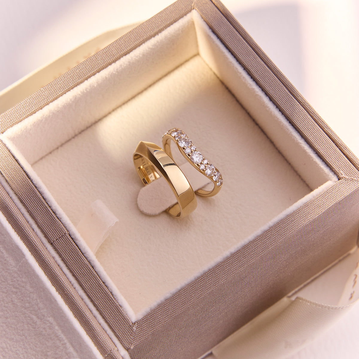 Arc Diamond Wedding Band in yellow gold curved design inspired by Eclipse Ring, elegant contour fit. Paired with Faros gents wedding band.