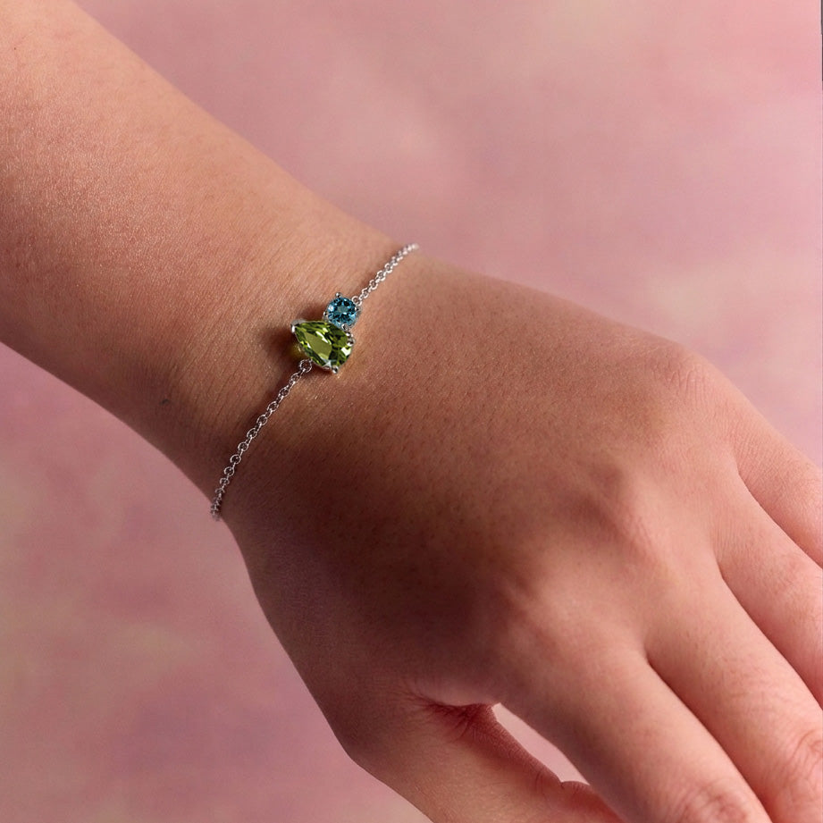 Birthstone bracelet white gold peridot and blue topaz family symbolic fine jewellery minimalist elegant gift bracelet