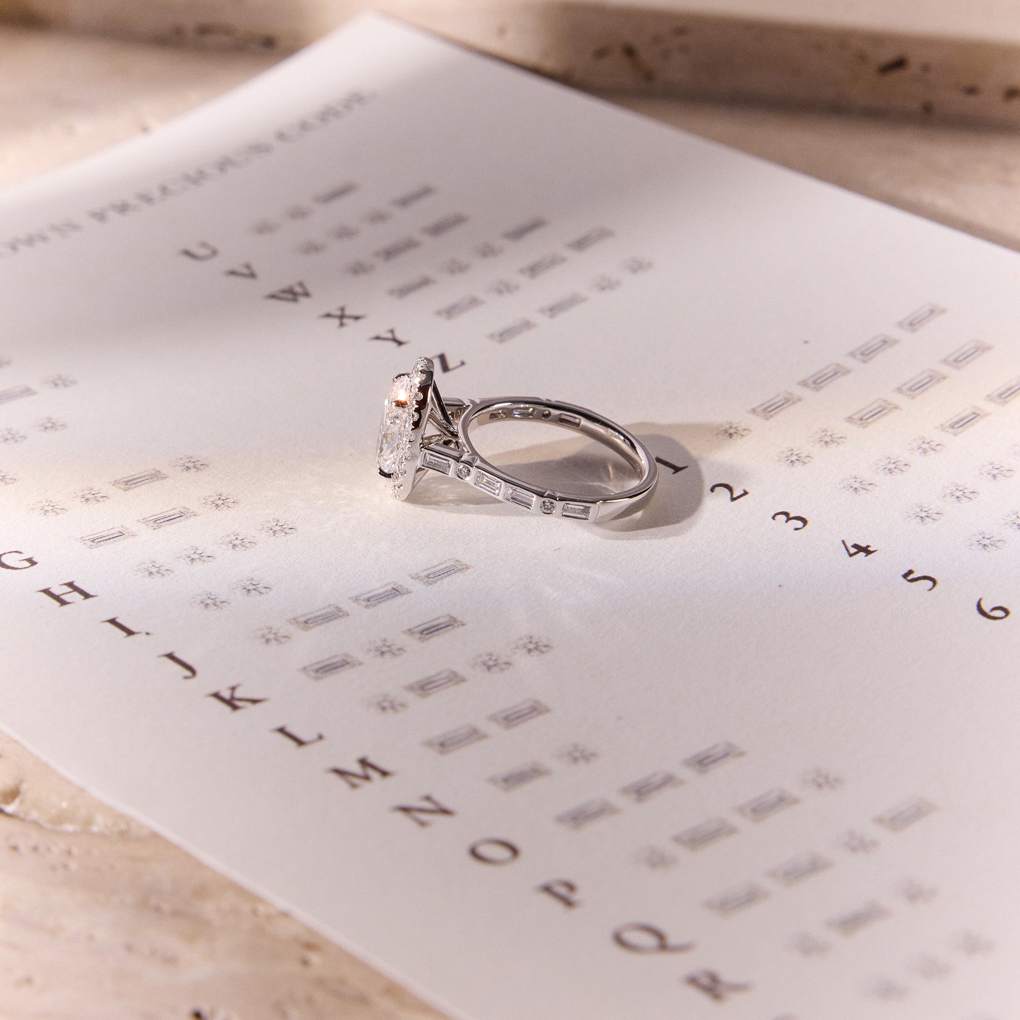 Bespoke Morse Code engagement ring with diamonds spelling initials "Q" and "N", romantic and elegant design.