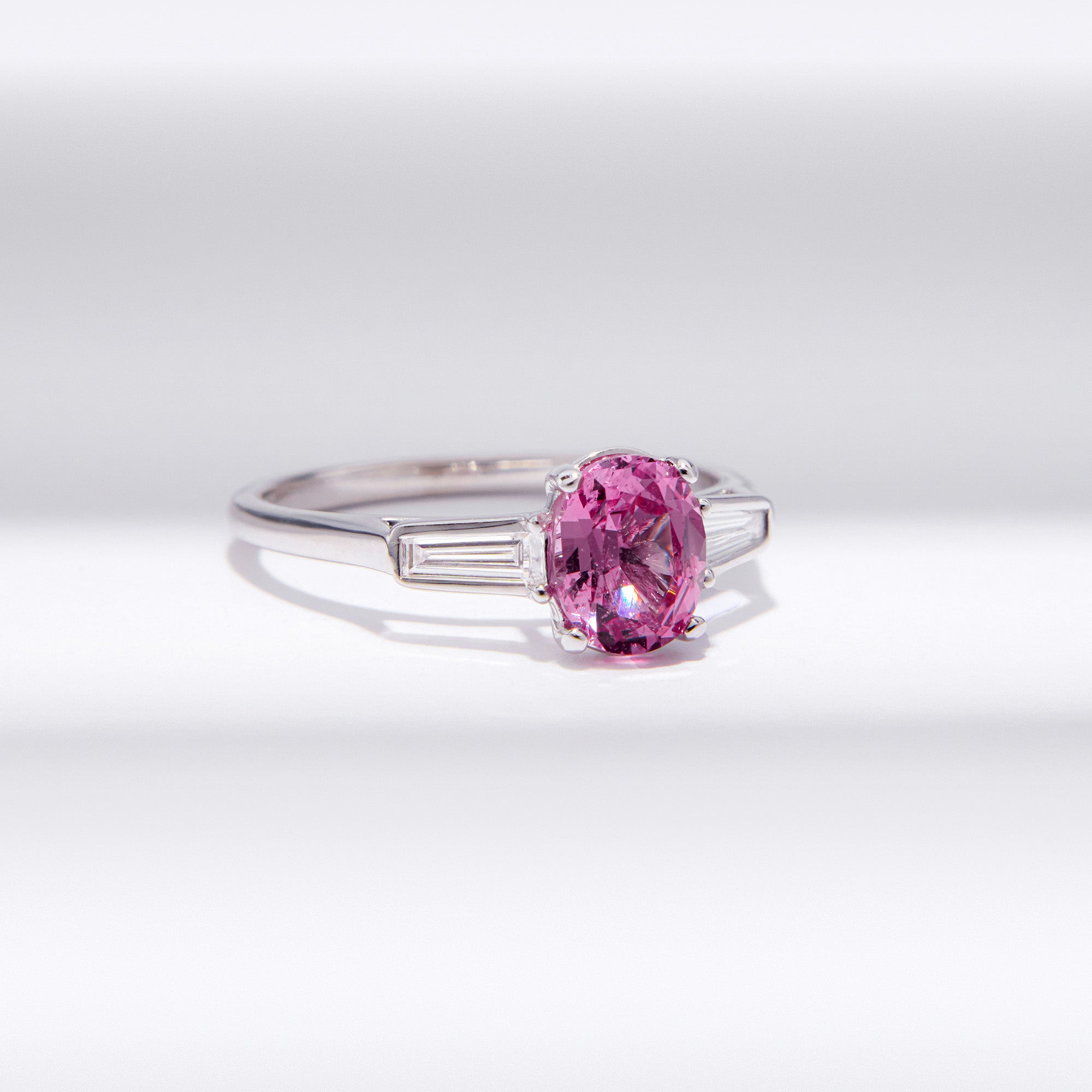 Elegant Pink Spinel Ring with 0.90 carat spinel and tapered baguette diamond accents in 18k white gold