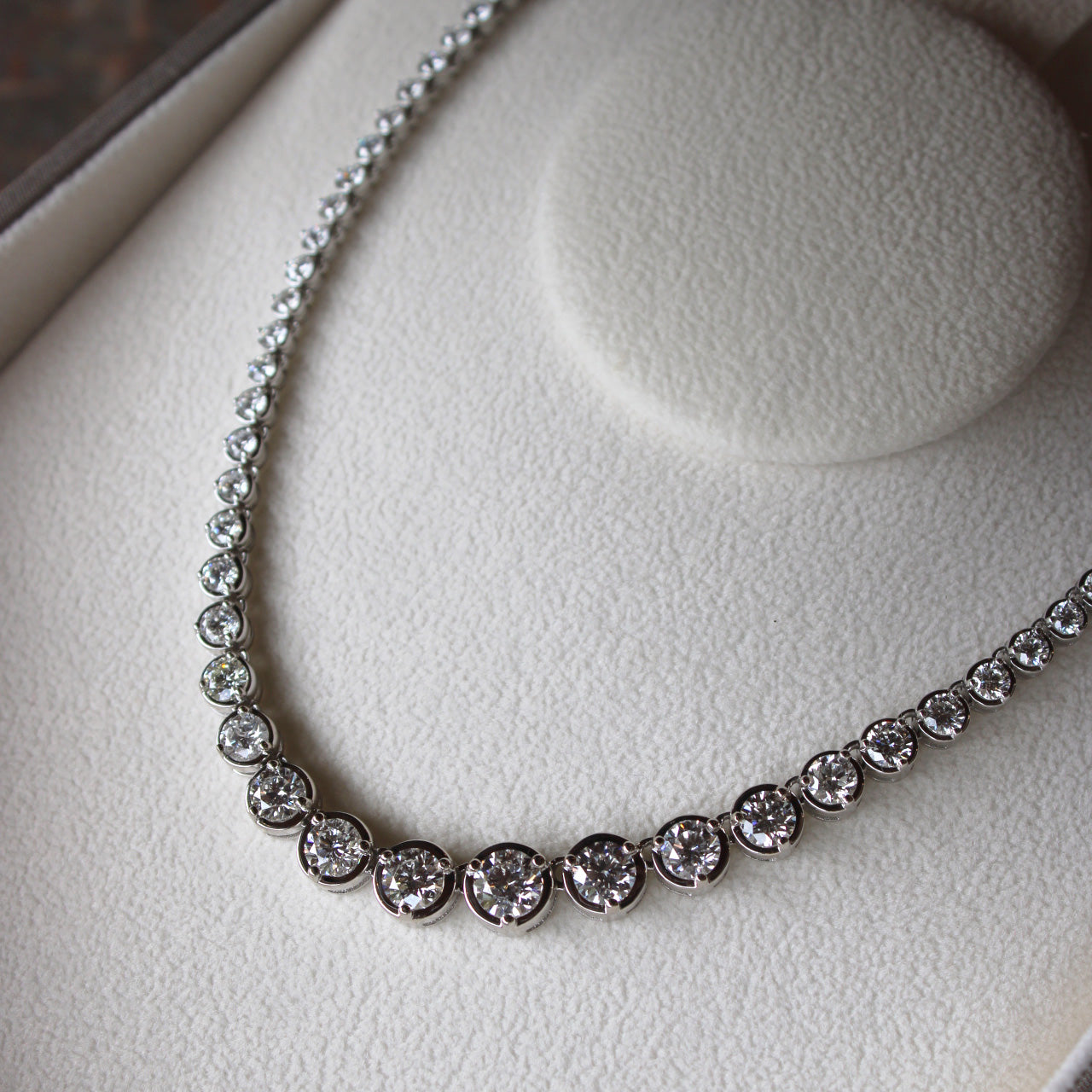 Bespoke graduated diamond tennis necklace with “Q” initial clasp, 12ct repurposed diamonds, elegant design.