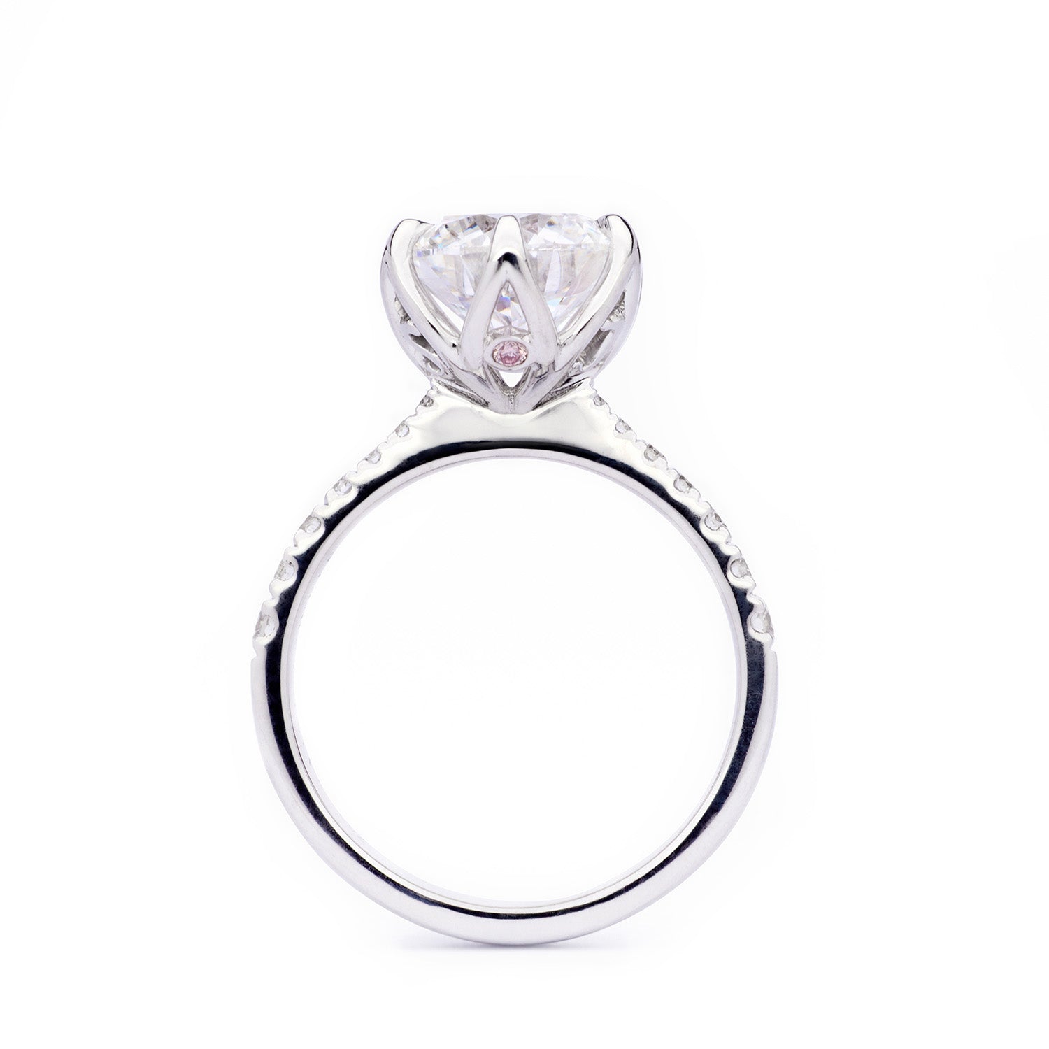 Sylvia Engagement Ring with 6-claw floral diamond setting, diamond-accented shoulders, and hidden pink sapphire on side view.