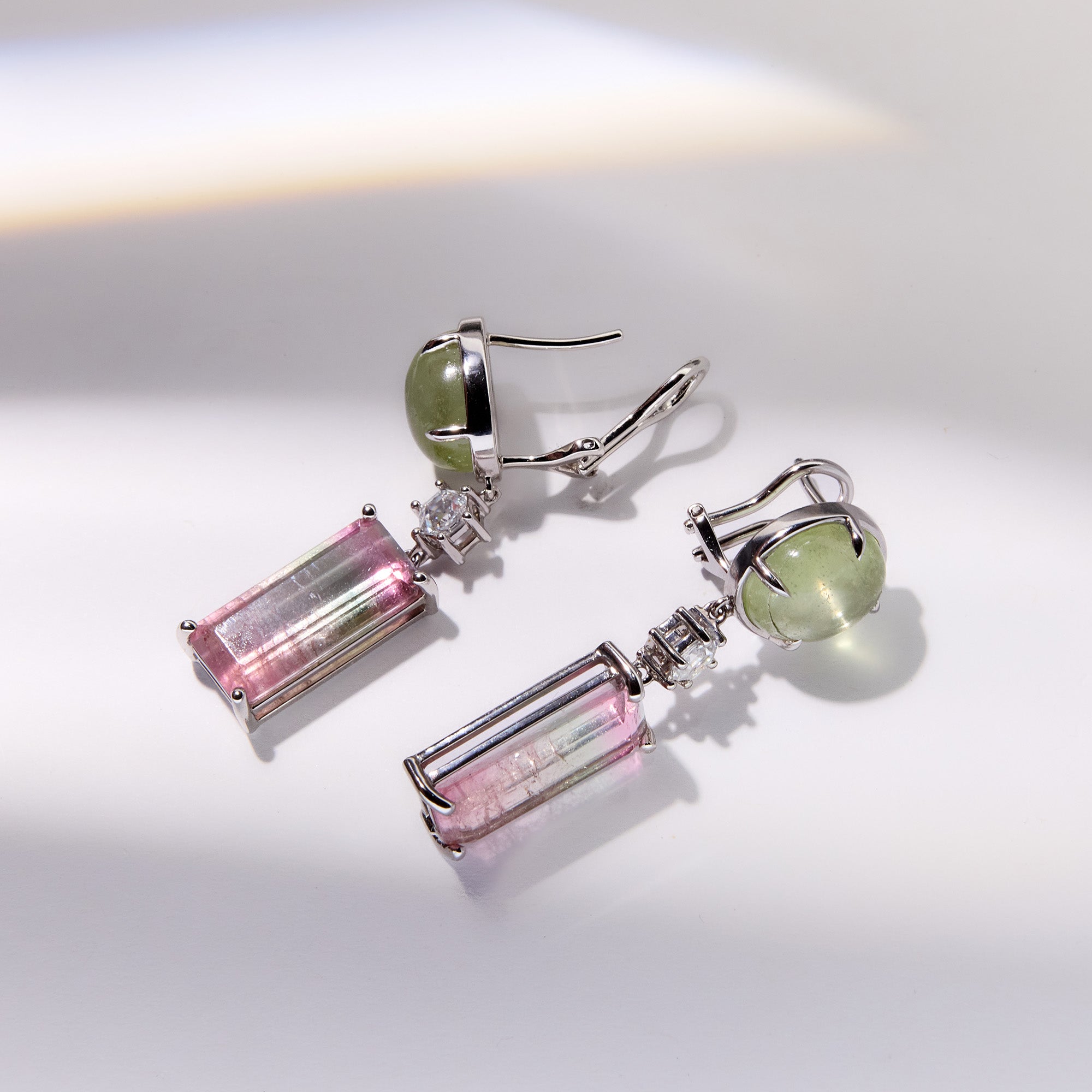 18k white gold earrings featuring aquamarine cabochon, watermelon tourmaline, and diamond