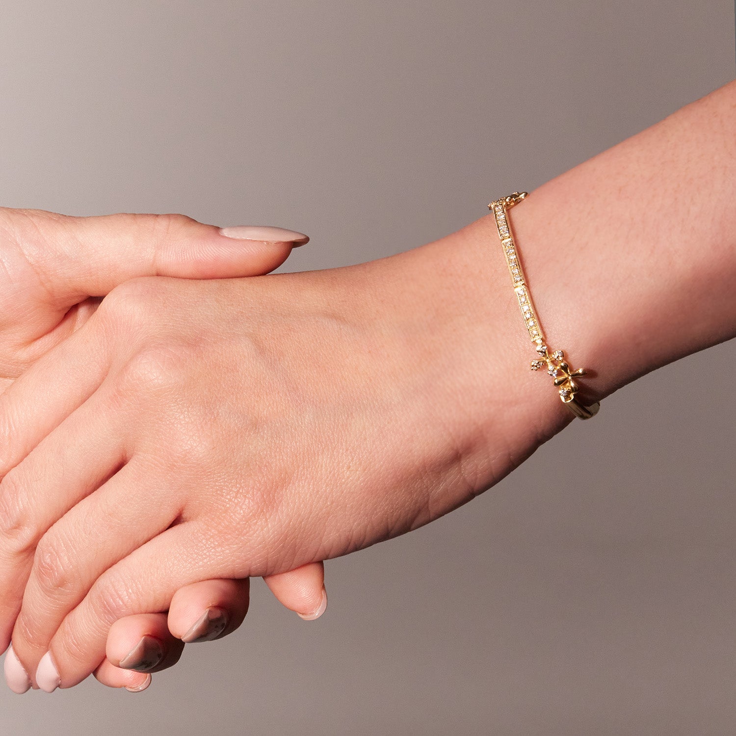 Wildflowers Diamond Bracelet in 18k yellow gold with 0.50ct diamonds and stylised floral motifs, worn on model.