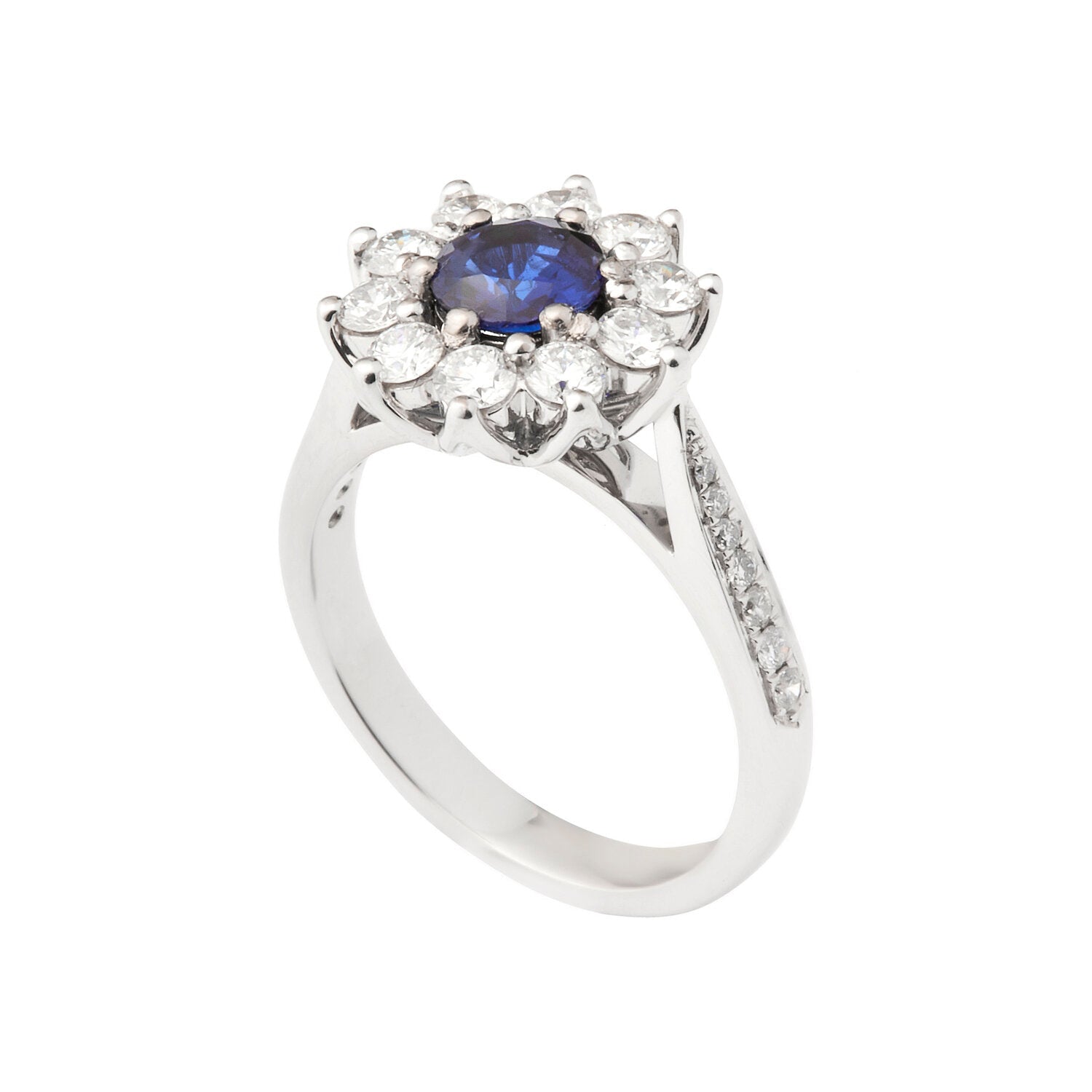Faith Jewels Gina blue sapphire and diamond ring with a halo of brilliant cut diamonds surrounding a 0.50 carat blue sapphire, set in a half diamond grain-set band