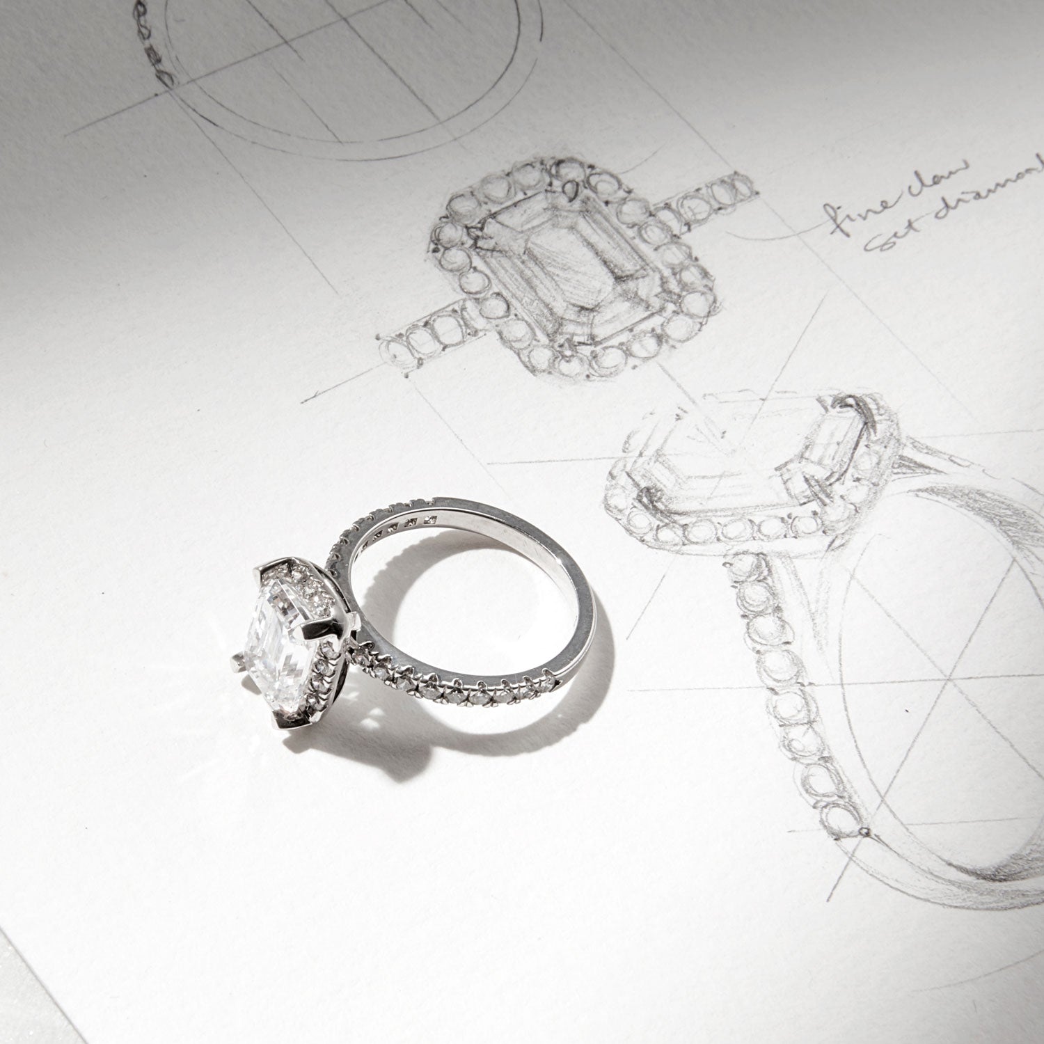 Faith Jewels Sophie diamond engagement ring featuring an elongated central diamond surrounded by a delicate diamond halo, set on a fine diamond-encrusted band