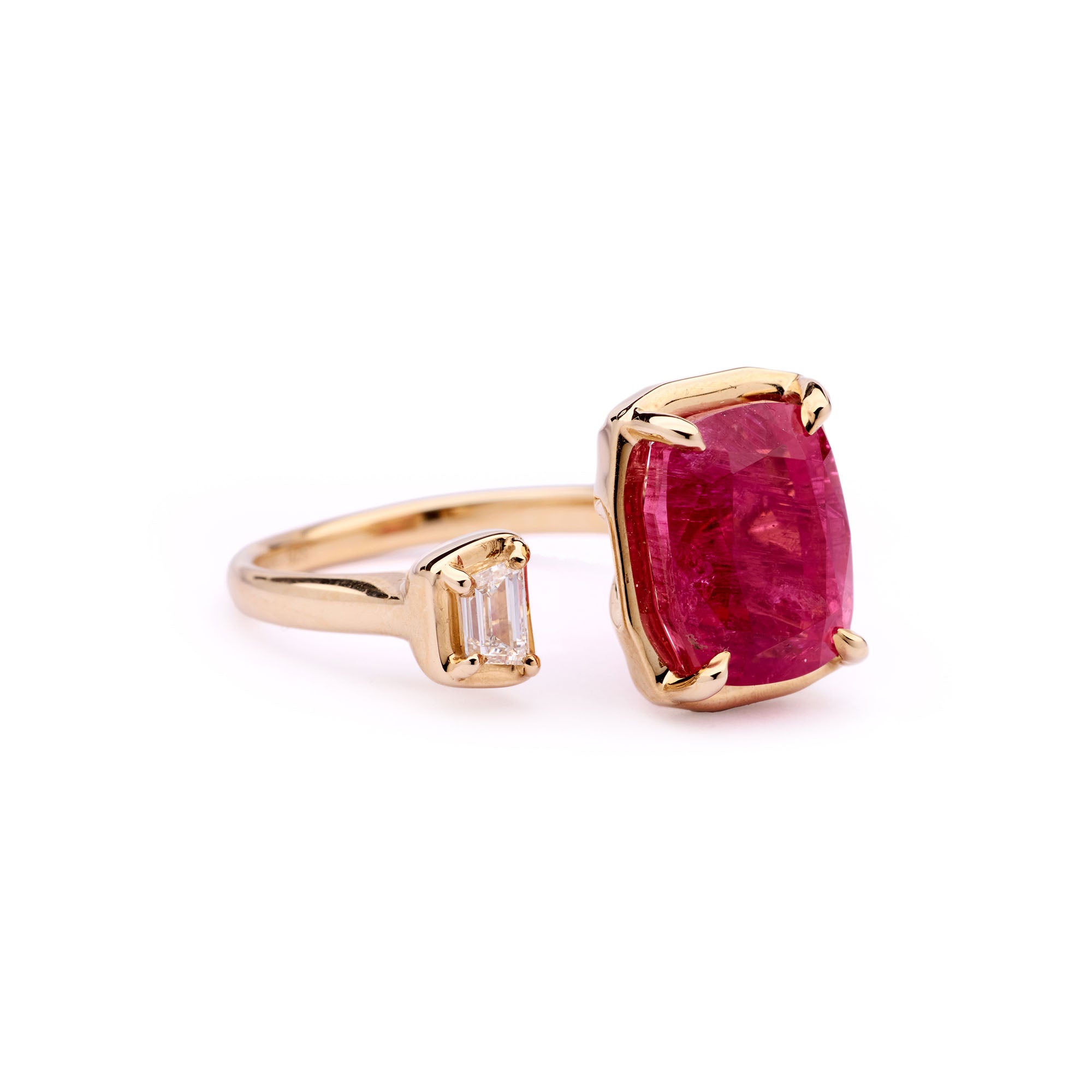 Faith Jewels Toi Et Moi ring featuring a vivid magenta-pink 5.90ct rubellite and a 0.20ct trapezoid white diamond set in 9k yellow gold