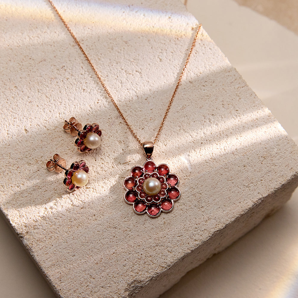 Floral-inspired pendant and earrings set in 9k rose gold with pink tourmalines and repurposed pearls.