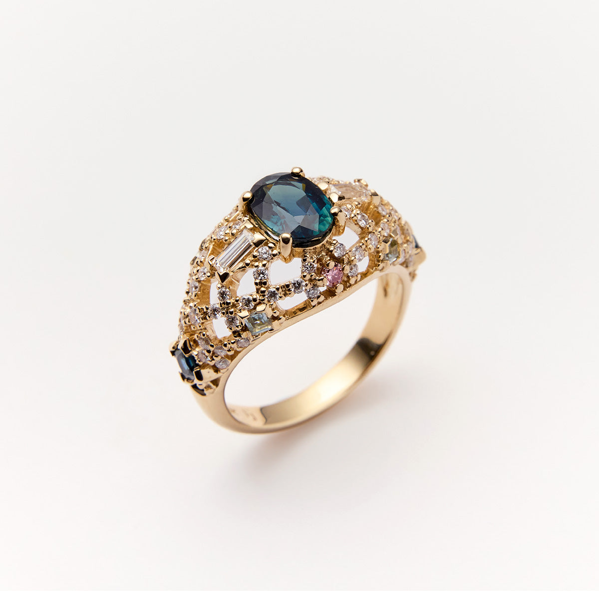 Gold dome ring with blue sapphire center stone and diamond accents