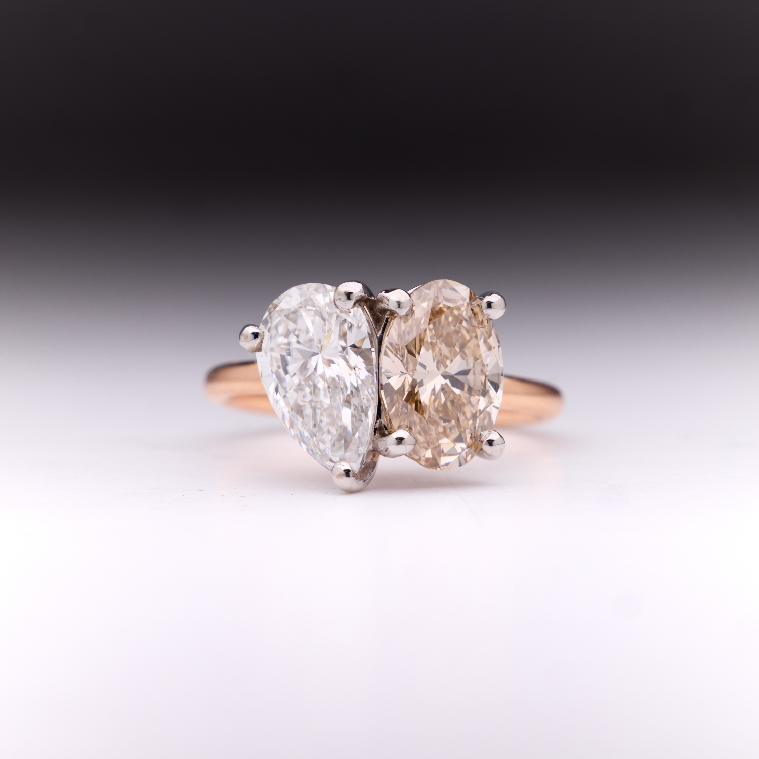 Faith Jewels bespoke ring featuring a champagne oval-cut diamond paired with a pear-cut diamond in a Toi Et Moi design.