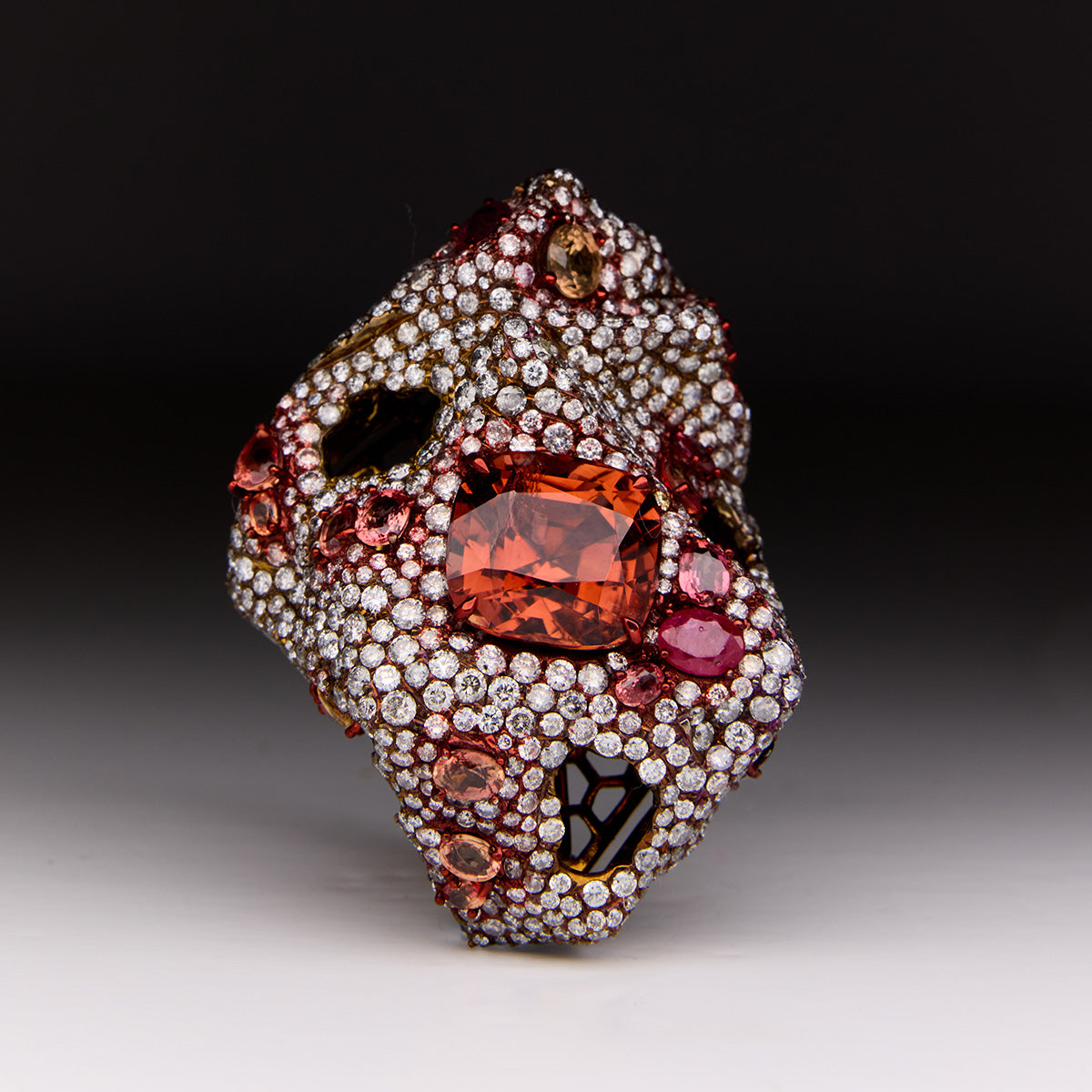 Faith Jewels Earth Ring. Sculptural titanium ring with brown, orange & yellow diamonds, padparadscha sapphires, rubies inspired by nature.