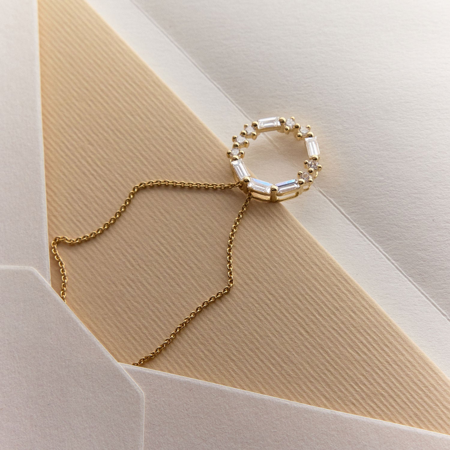 FJ 18k Yellow gold circle pendant with round and baguette diamonds spelling “LOVE” in Morse code.
