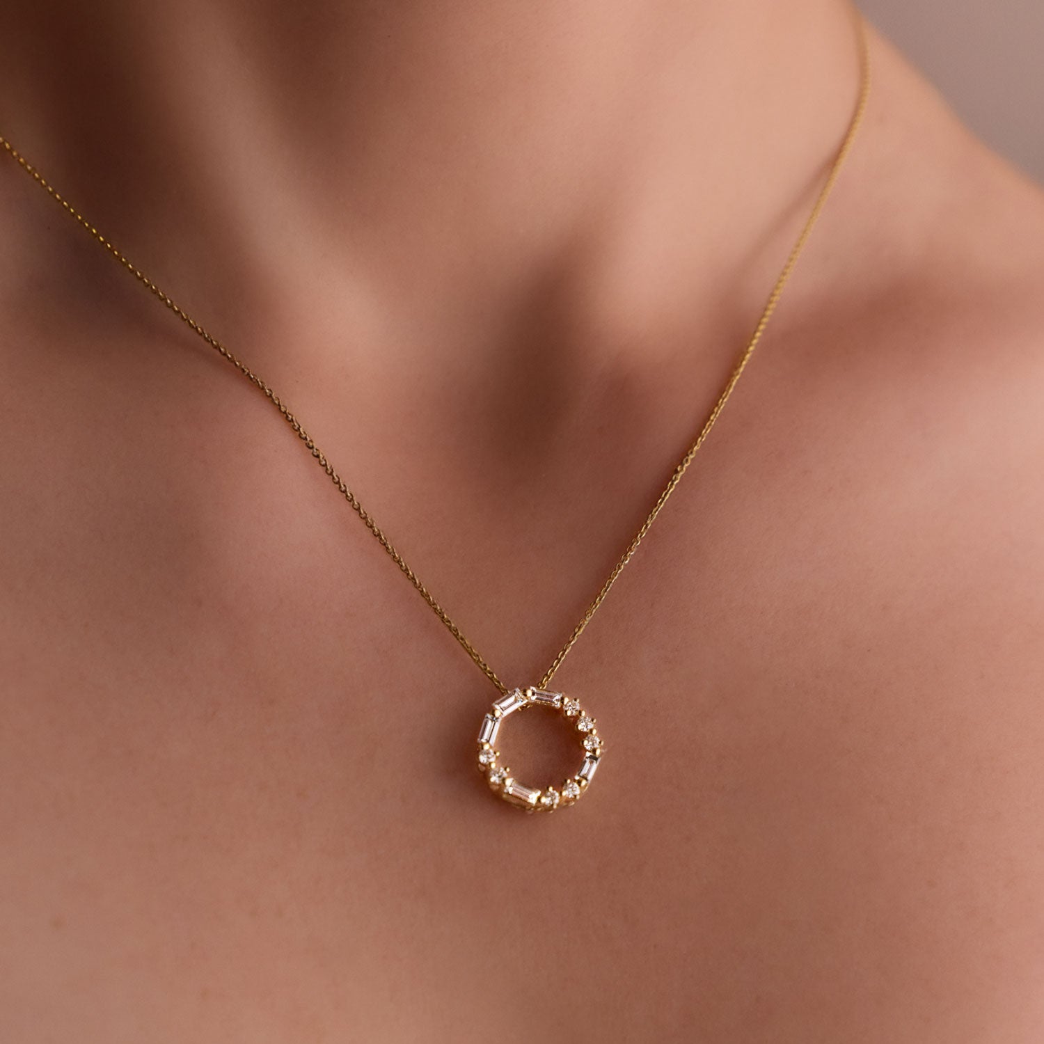 FJ 18k Yellow gold circle pendant with round and baguette diamonds spelling “LOVE” in Morse code on neck.