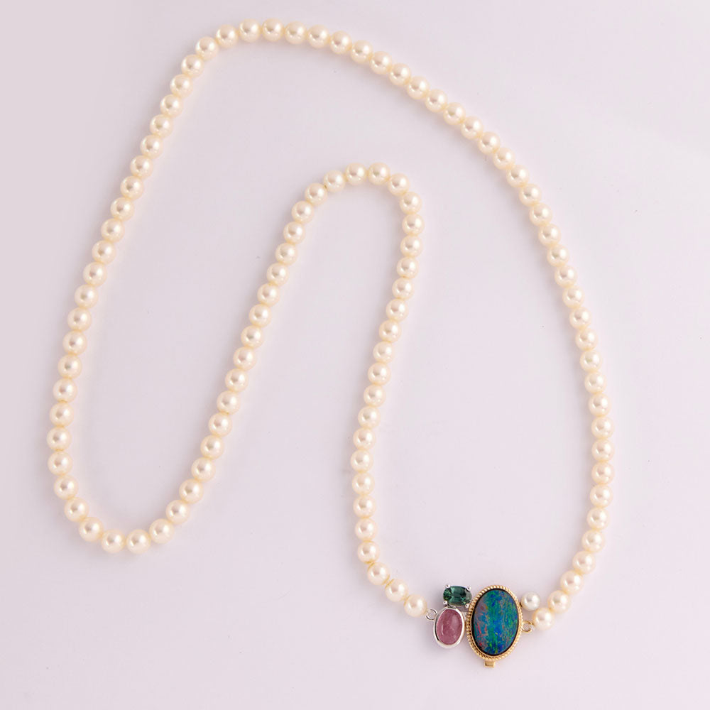 Faith Jewels Heirloom pearl necklace with a unique clasp made from opal, tourmaline, and mixed metals, blending family gemstones into a modern statement piece.