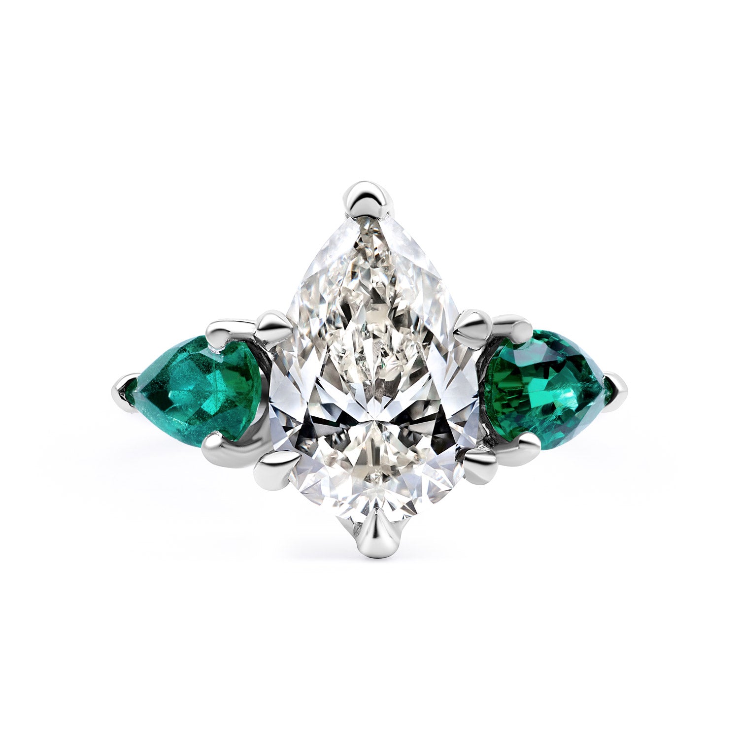 Faith Jewels Belle Époque engagement ring with a pear-cut diamond center, flanked by pear-cut emeralds, set in 18k white gold with elegant sweeping claws