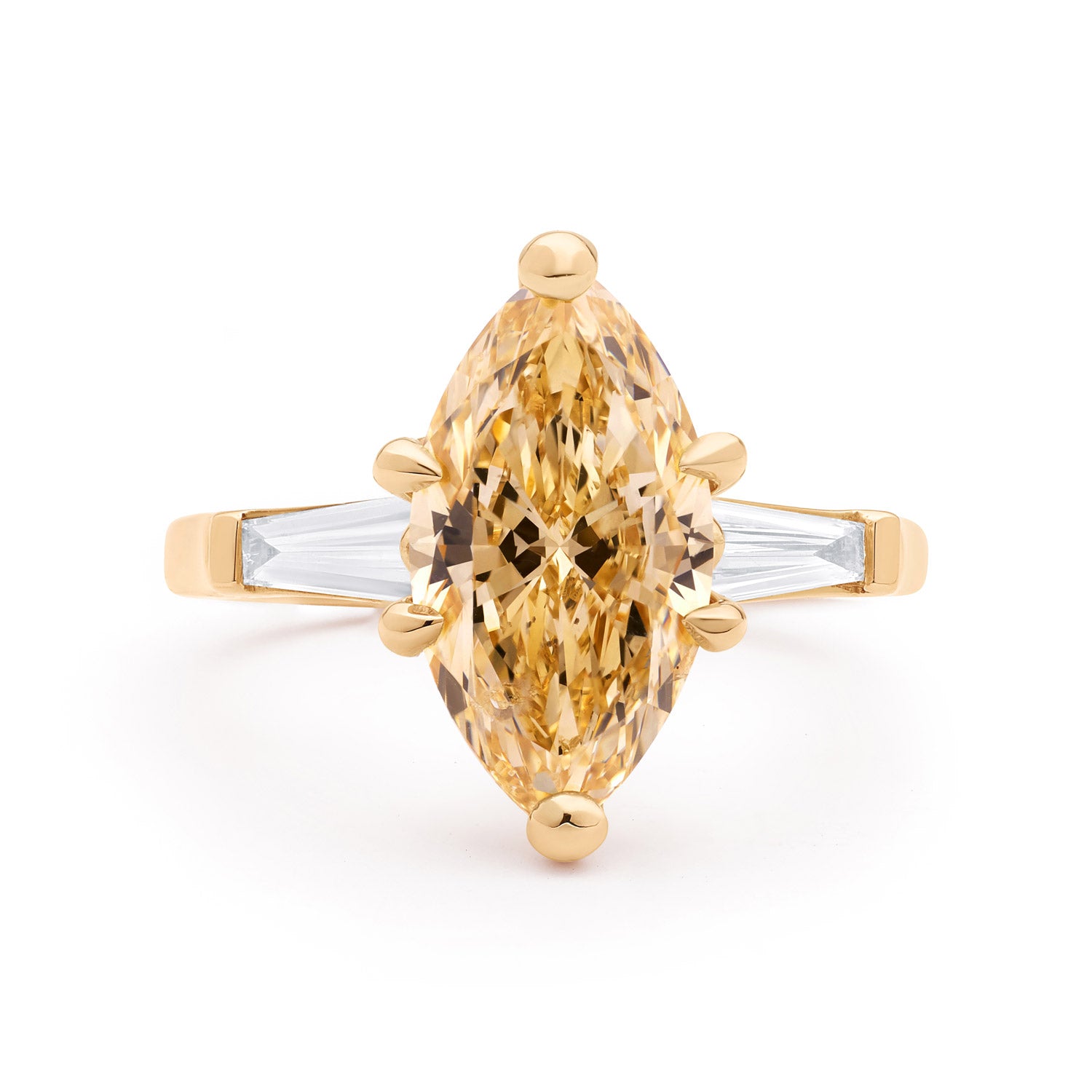 Faith Jewels Aimee ring featuring a champagne marquise brilliant diamond with white tapered baguette diamonds in an 18k yellow gold setting